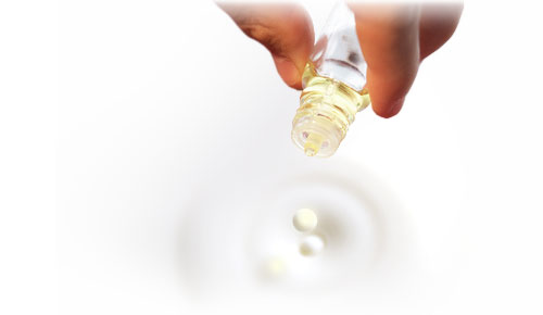 dripping oil into milky liquid