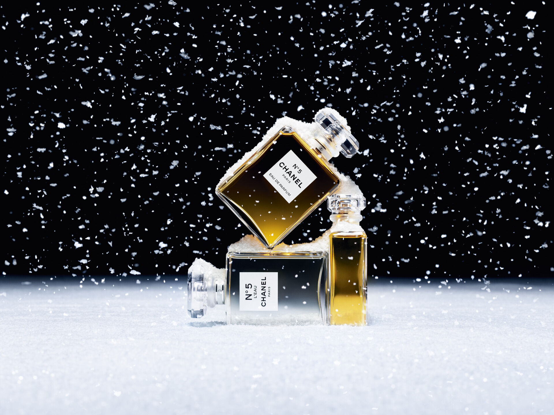 Chanel ad bottles in snow