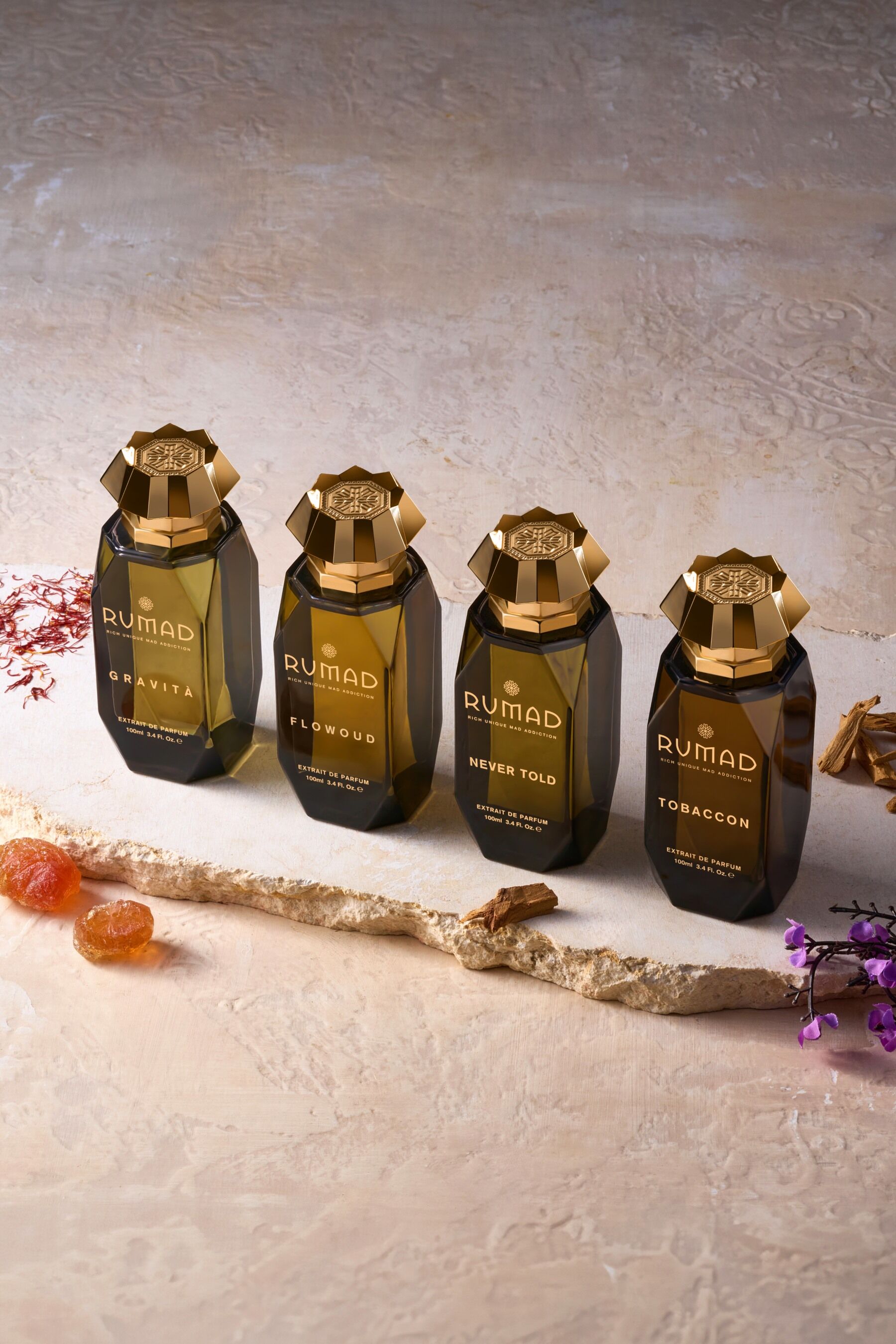 The four fragrances which make up the Rumad line stood in a line together on pale stone
