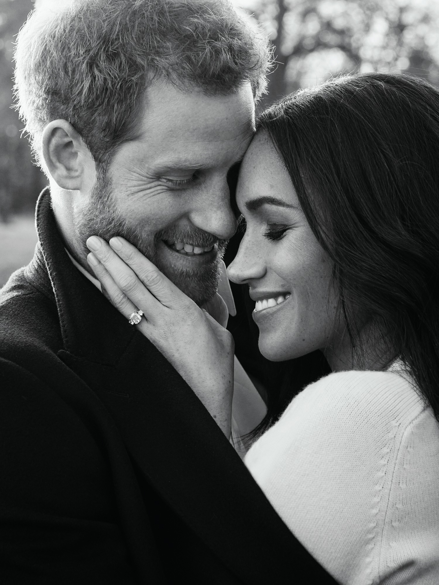 Prince Harry and Meghan Markle hugging engagement photo