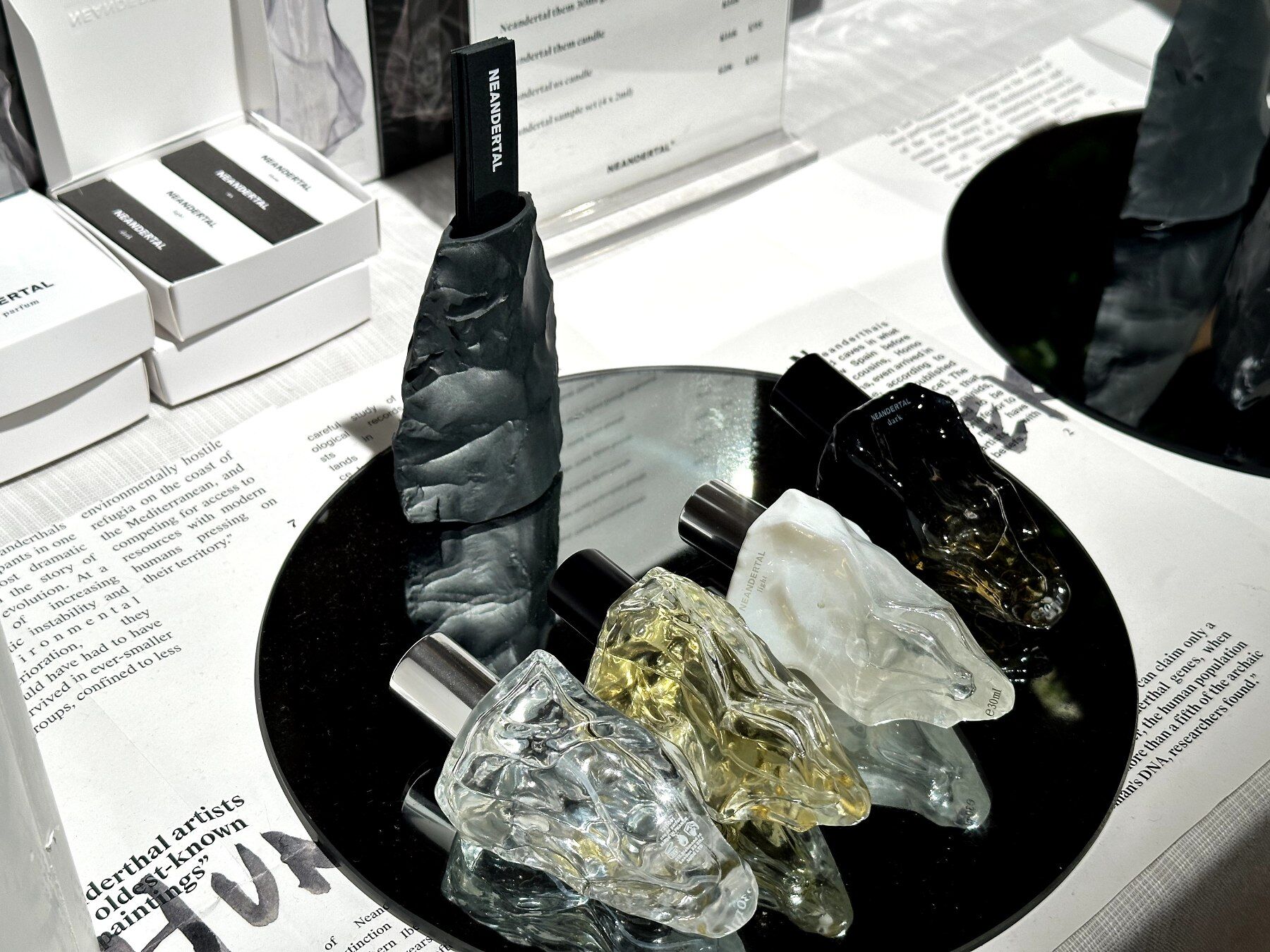 Group of four Neandertal perfumes on a mirror tile