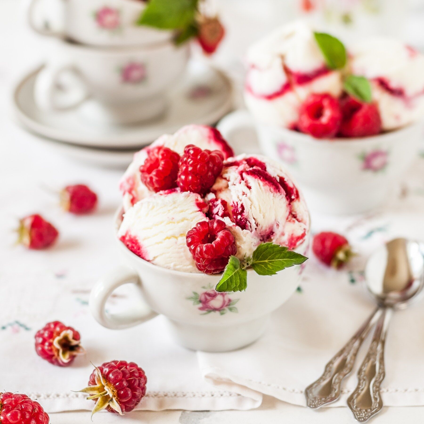 A raspberry ripple ice cream in a tea cup
