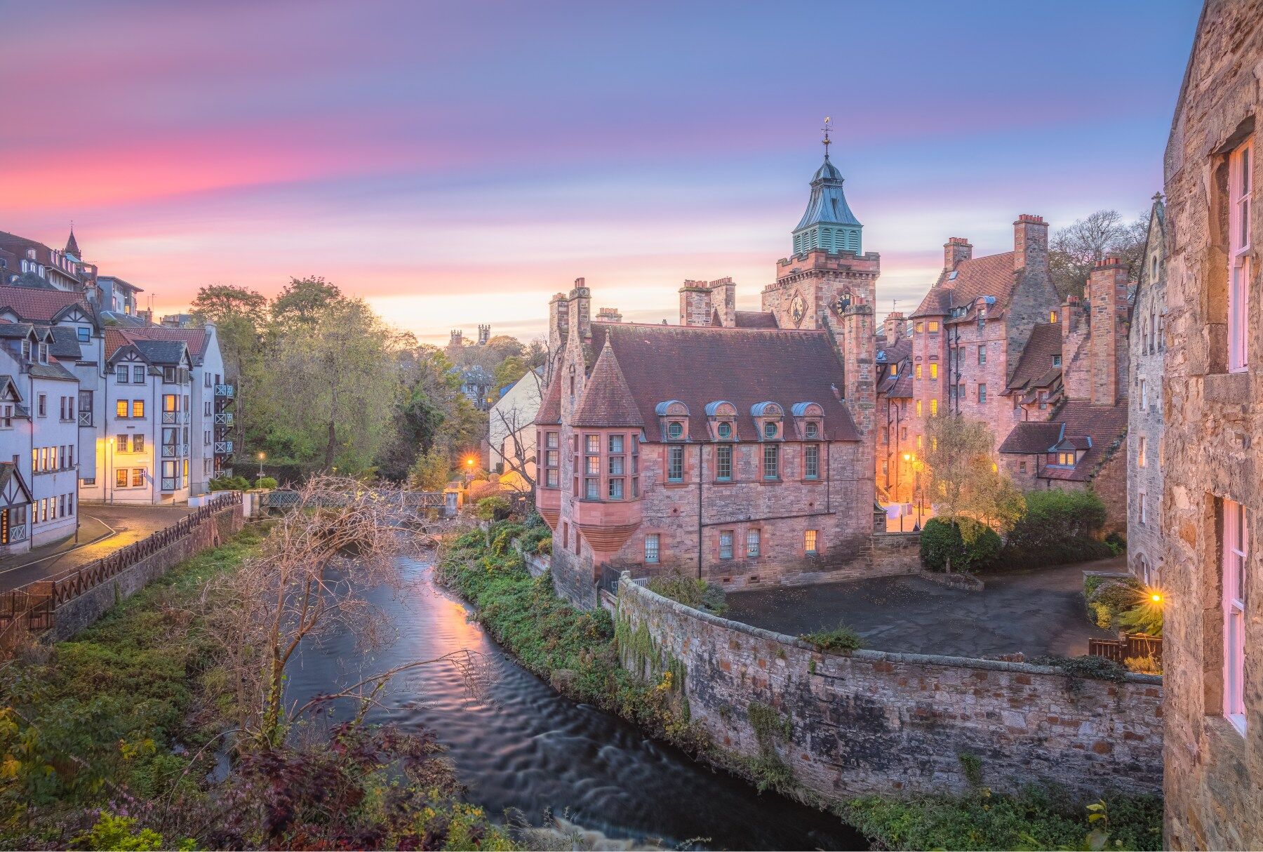 A photo of Stockbridge in Edinburgh showing old buildings against a nice sunset