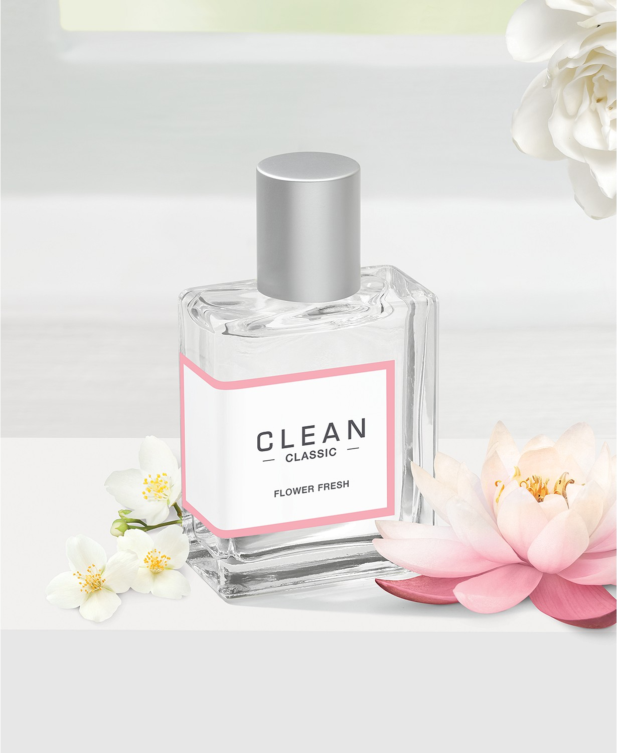 Clean Classic on a white backdrop with white flowers nearby