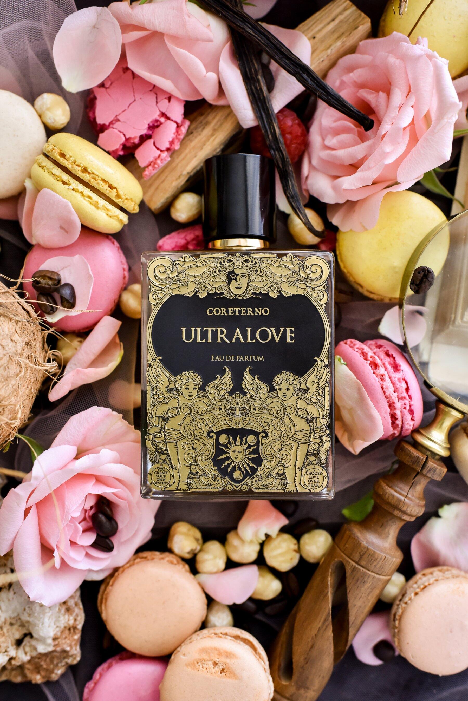 Coreterno's Ultralove surrounded by macarons, vanilla pods and rose petals