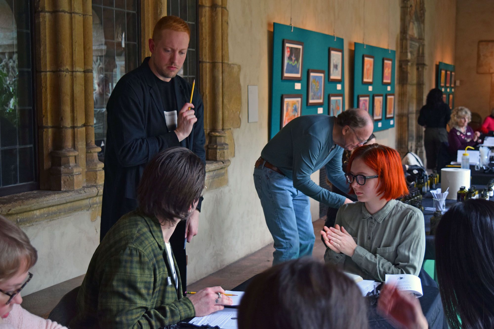 Michael lectures and helps out some students.