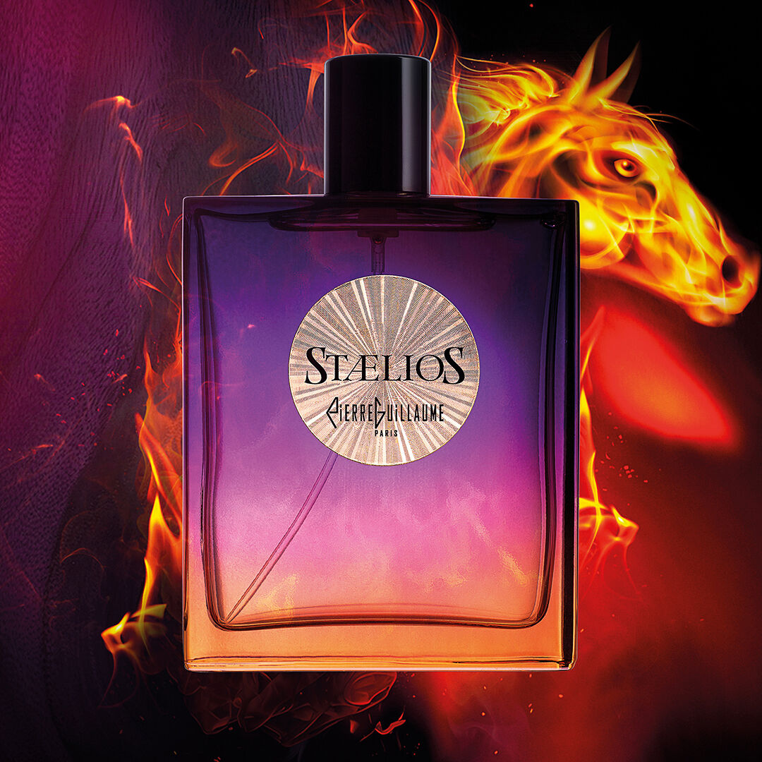 A bottle of Staelios set against a backdrop of purples offset by a horse image made of flames