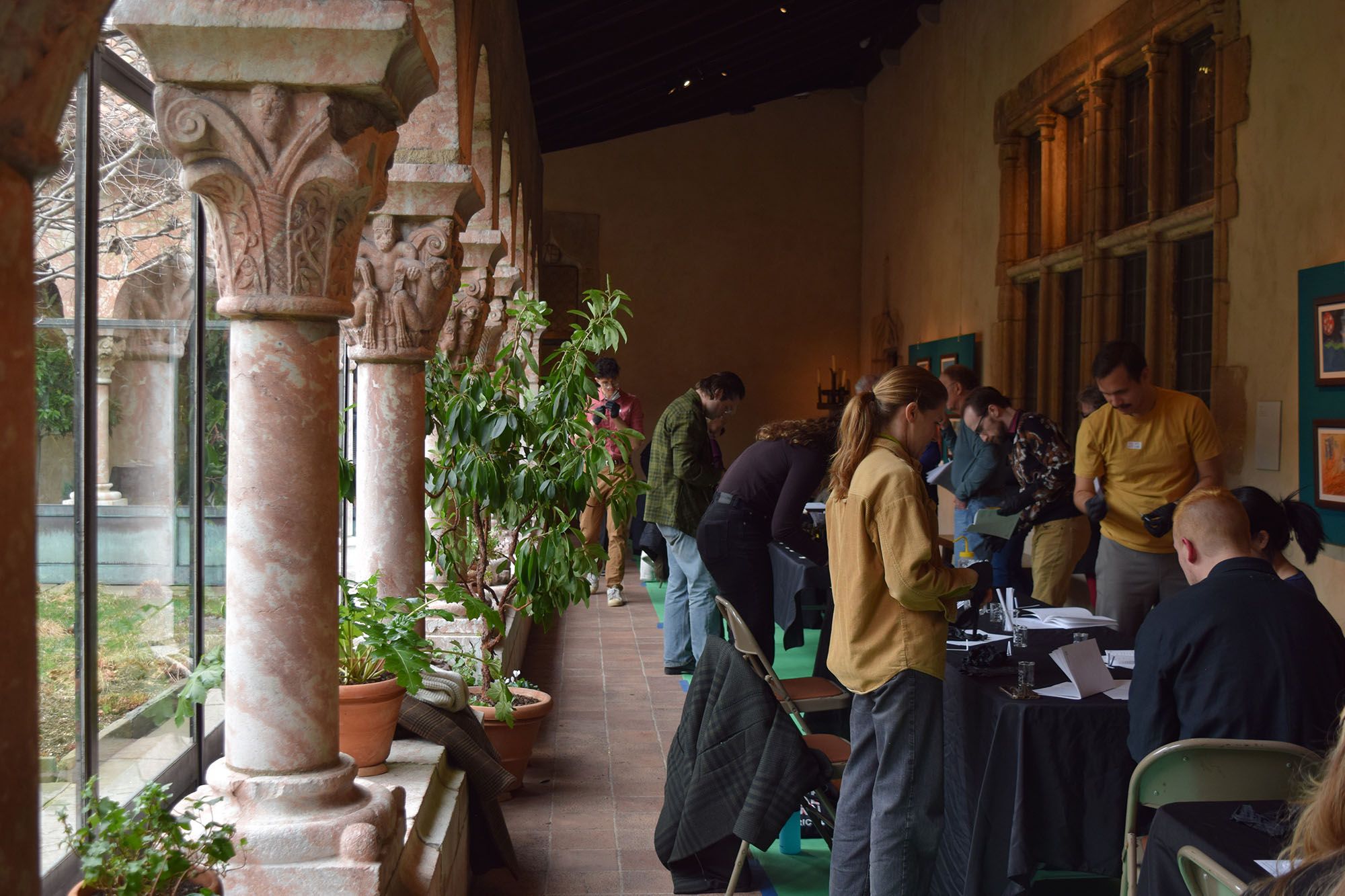 Students working at the Met's Perfume event at the Cloisters.