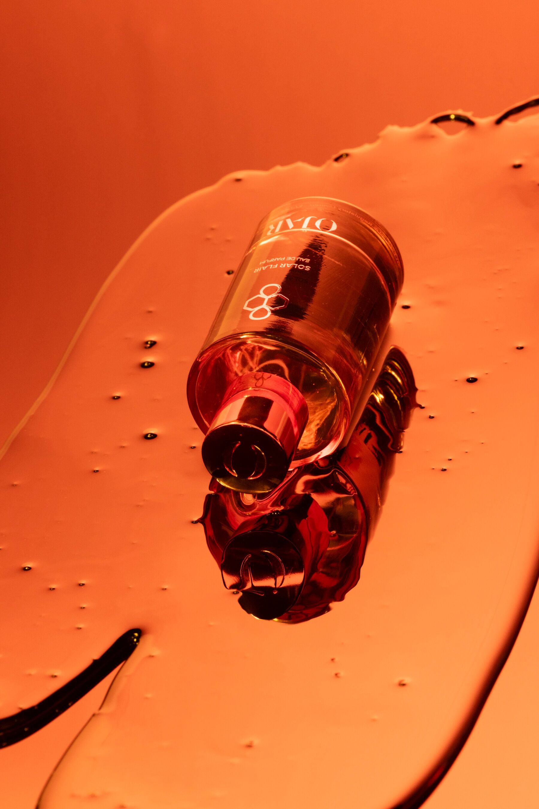 A bottle of Solar Flair in a puddle of goo