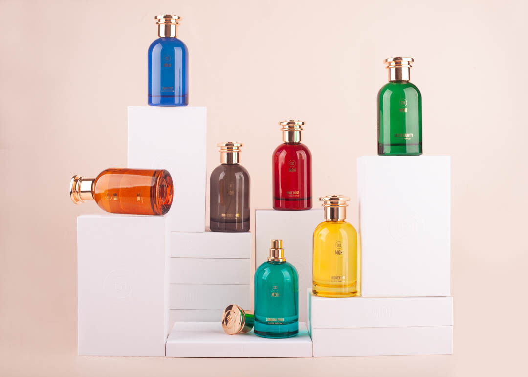 A group of MOH fragrances stood on white boxes
