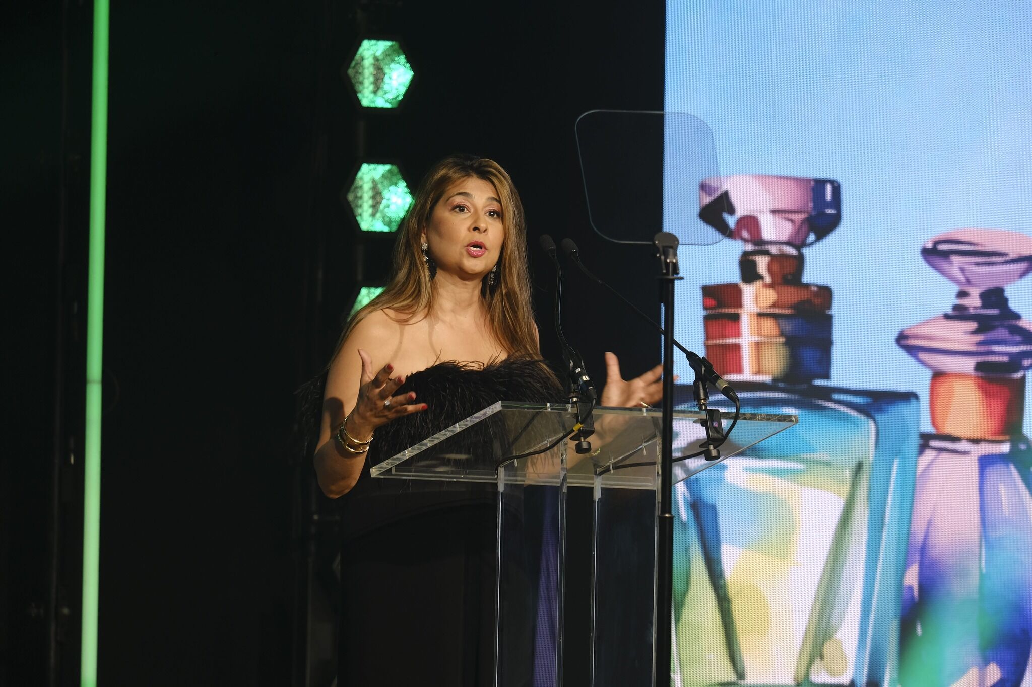 Fragrance Foundation Chairman Sabnani Dalamal stood at a lectern on stage