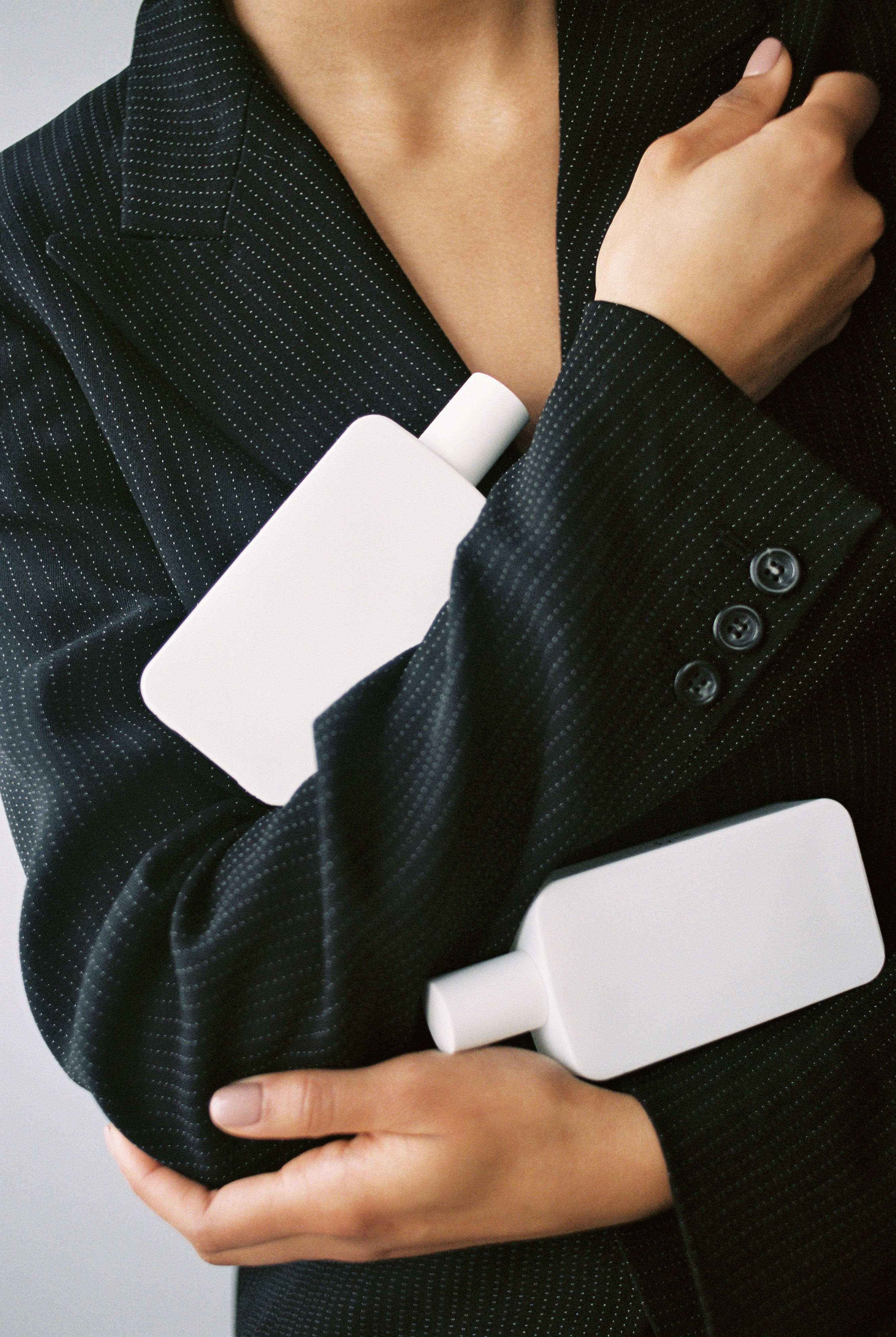 Rule of 72 depicted against the body of a woman wearing a pinstripe suit jacket