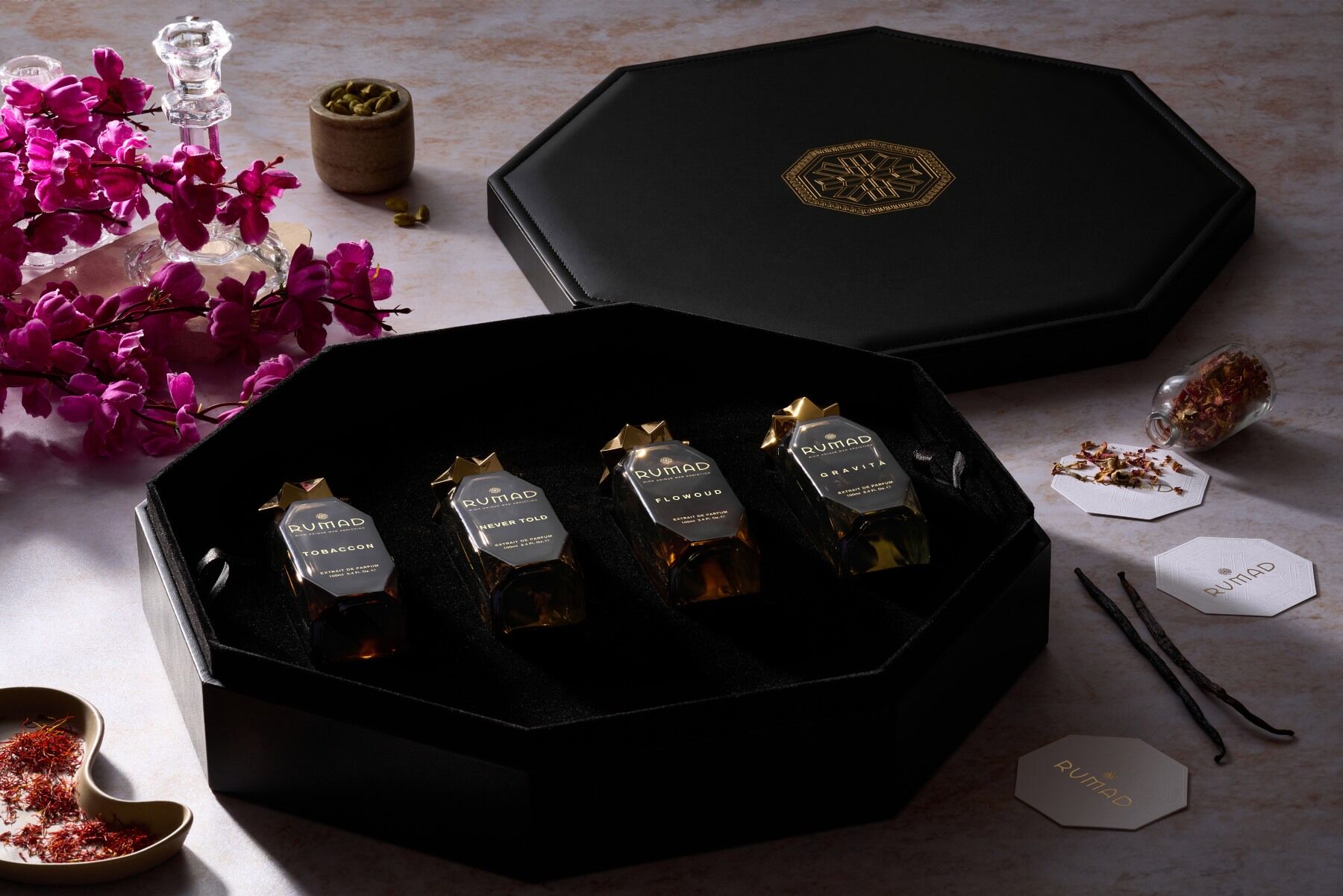 The four Rumad fragrances in a black koffret box