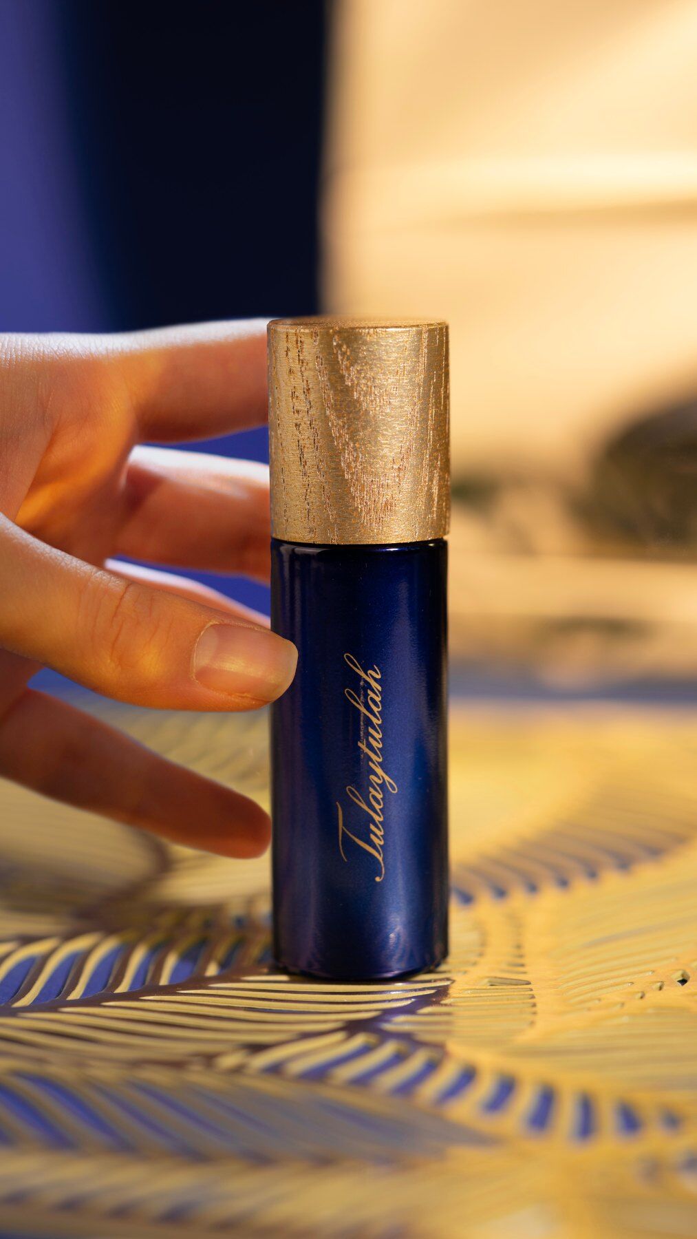 A 10ml of Tulaytulah Obscur against a gold backdrop