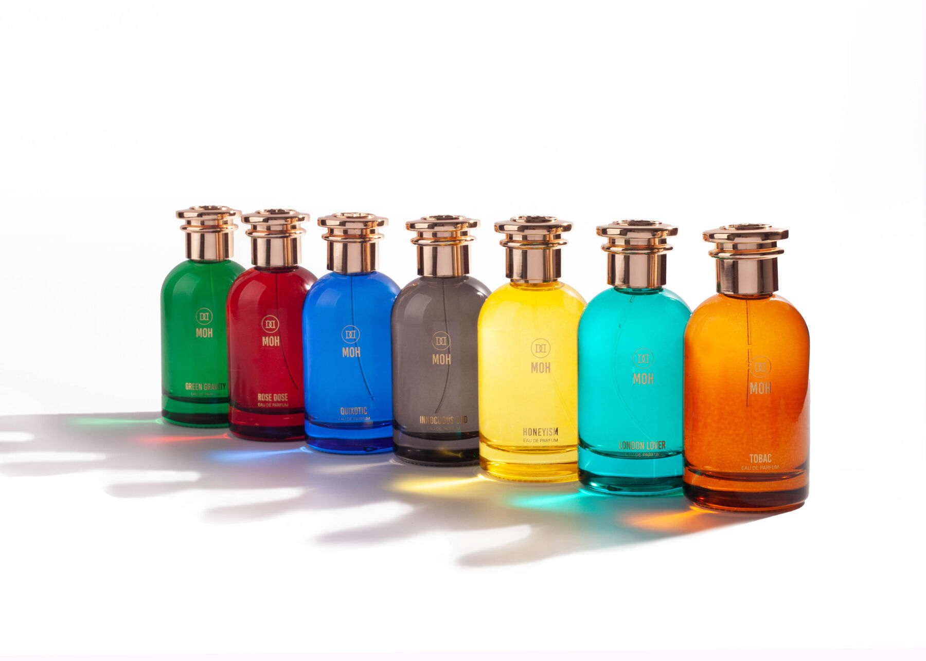 A group of MOH fragrances displayed in a line on white