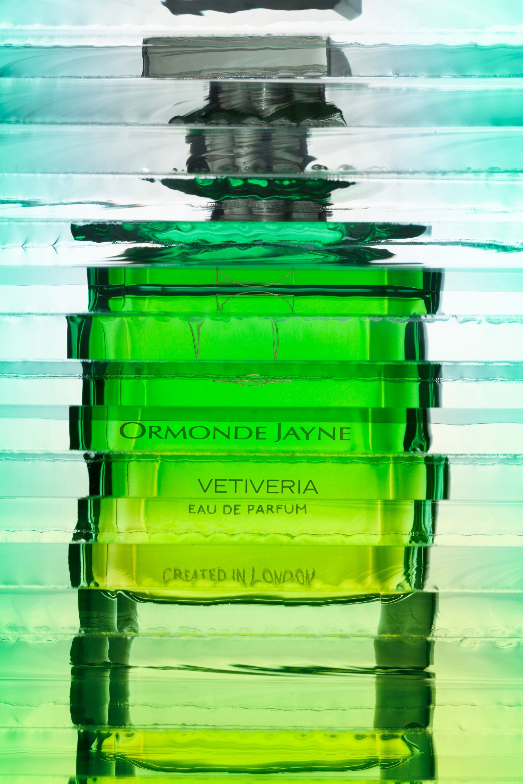 A bottle of Vetiveria by Ormonde Jayne refracted by horizontal lines of light