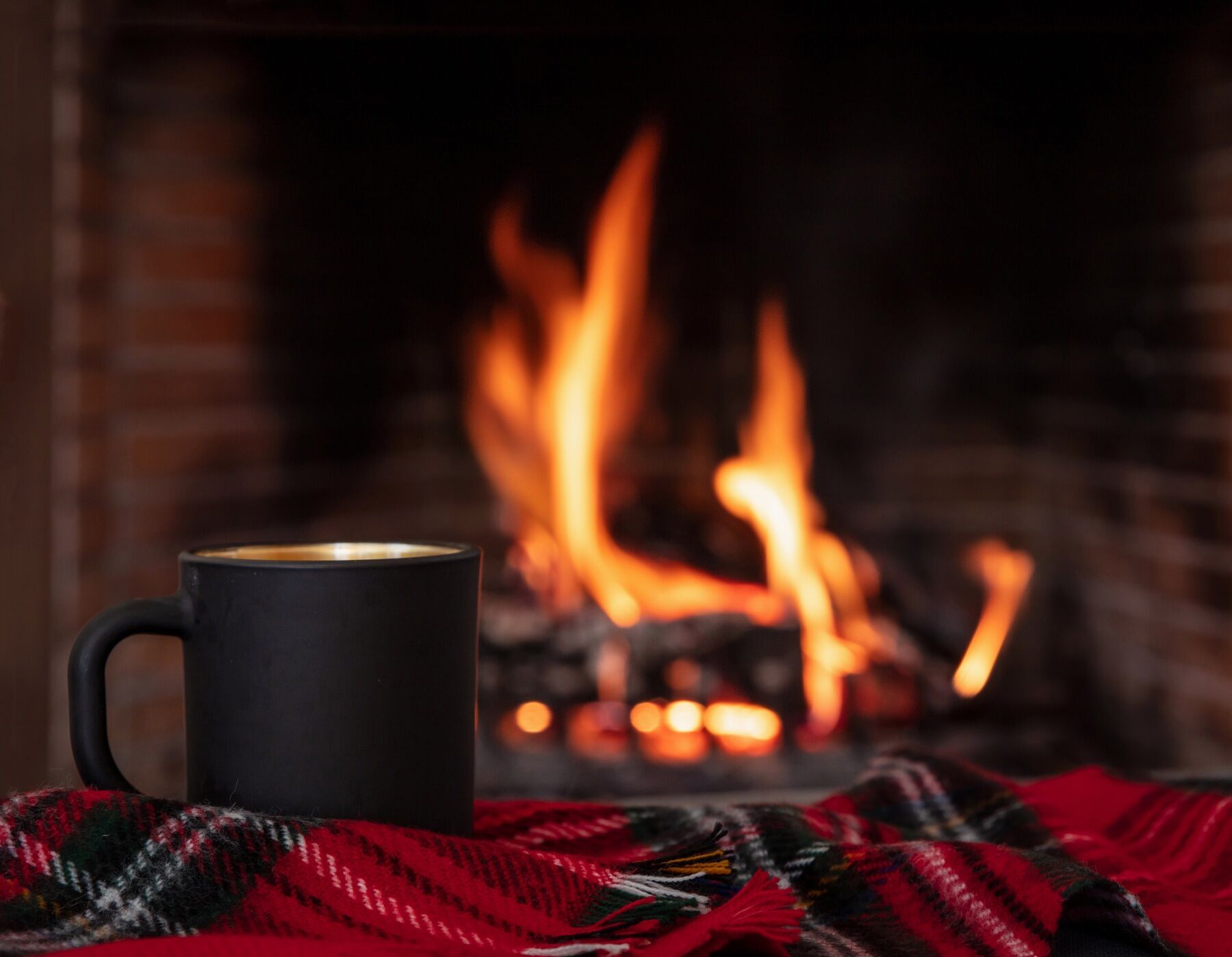 A cup of cocoa by the fireside in winter
