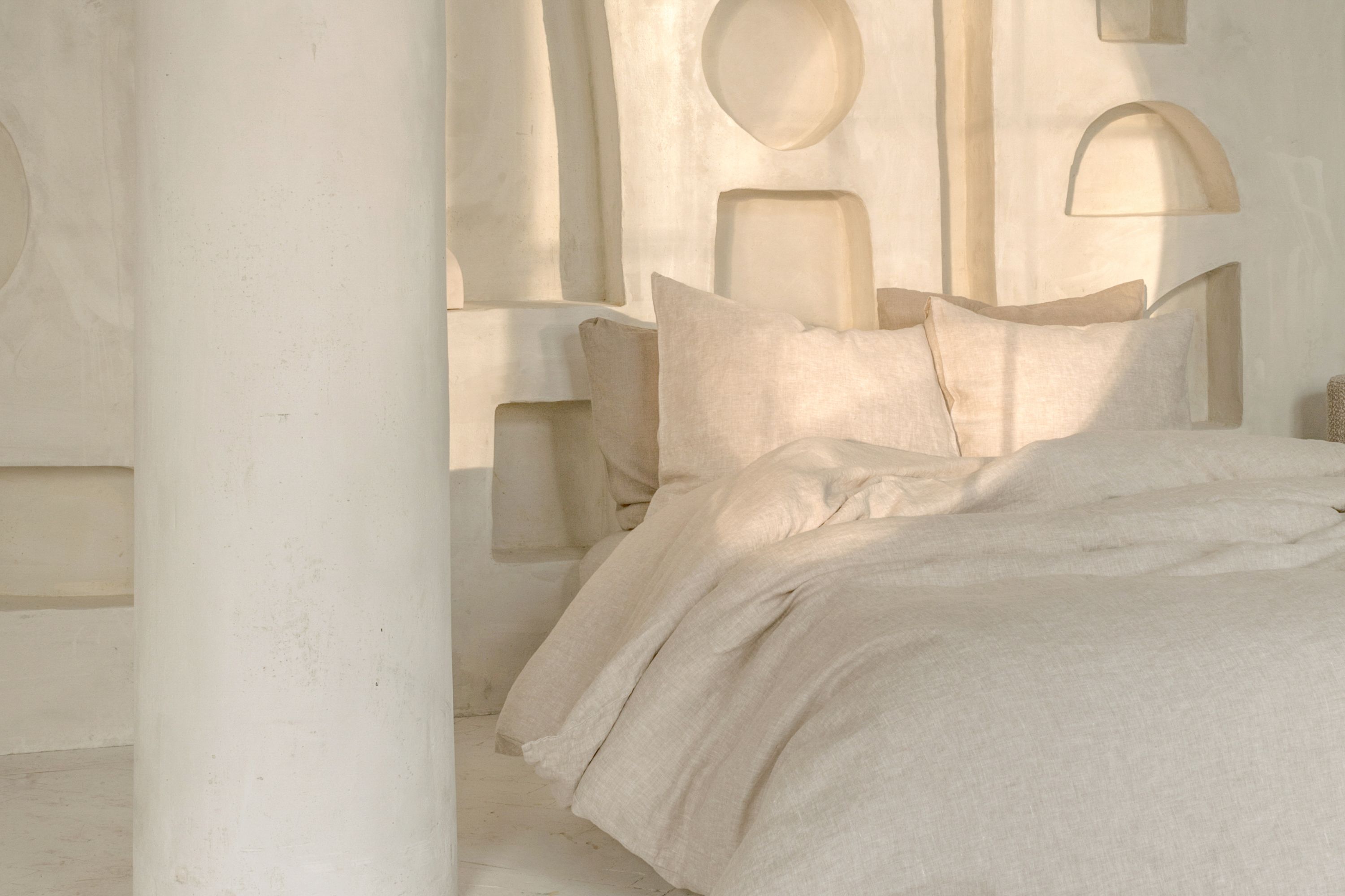bed with cream sheets