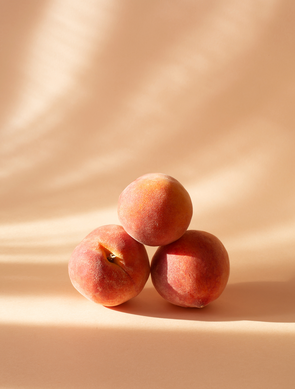 Three whole Peaches