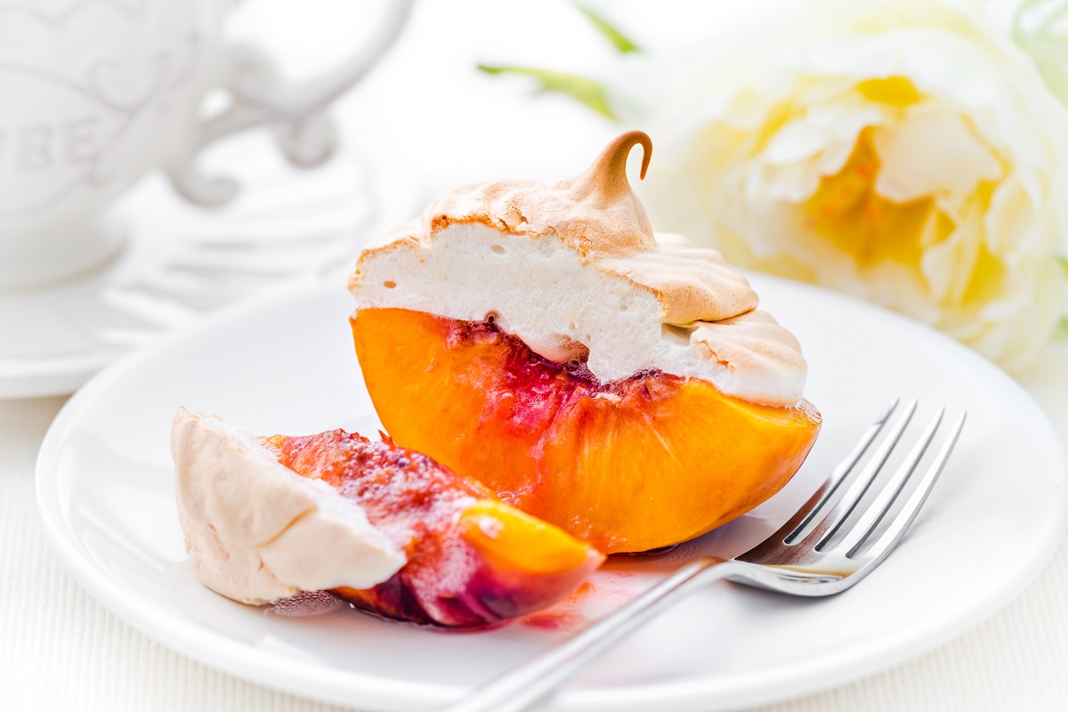 peach dessert on a plate with meringue