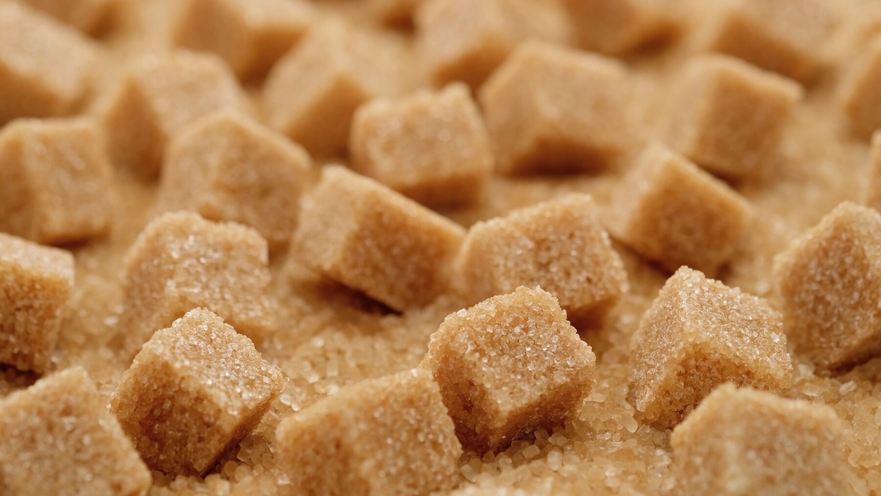 Brown sugar cubes on a field of brown sugar