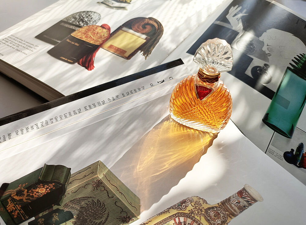 Ungaro Diva bottle against a backdrop of books.