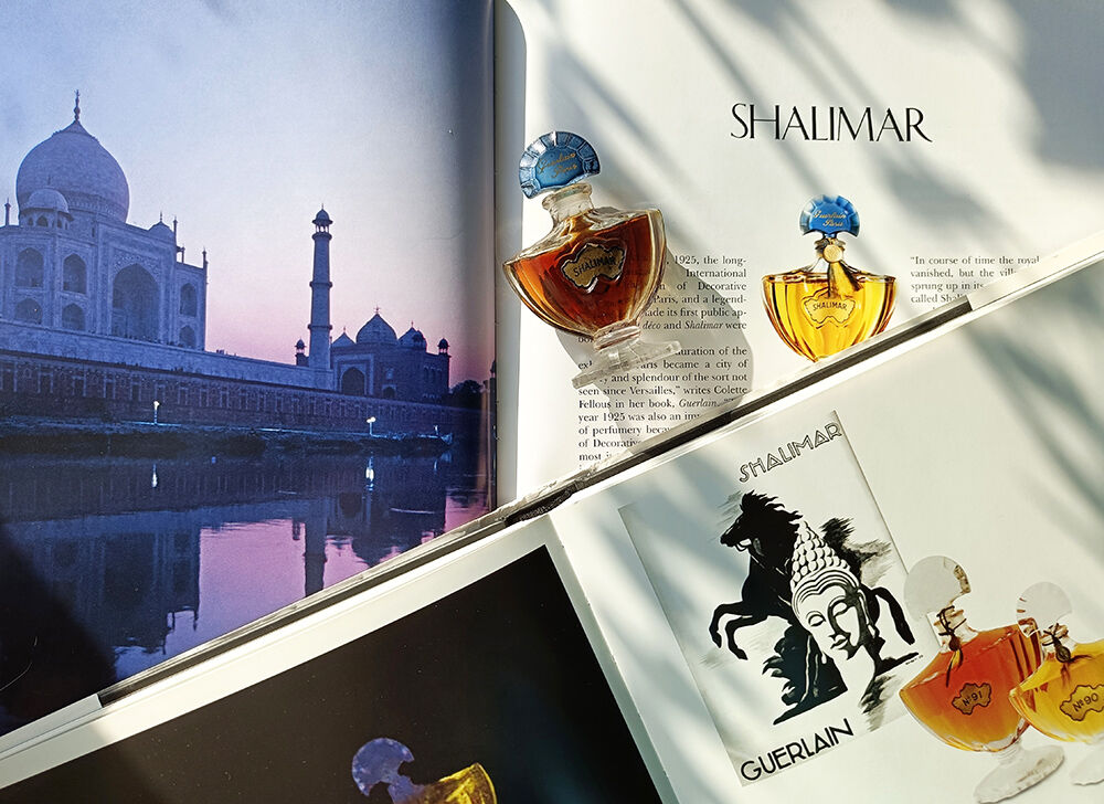 Bottle of Shalimar on books.