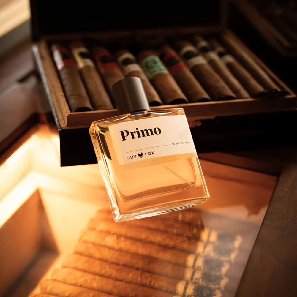 Primo Extrait de Parfum against a cigar case.