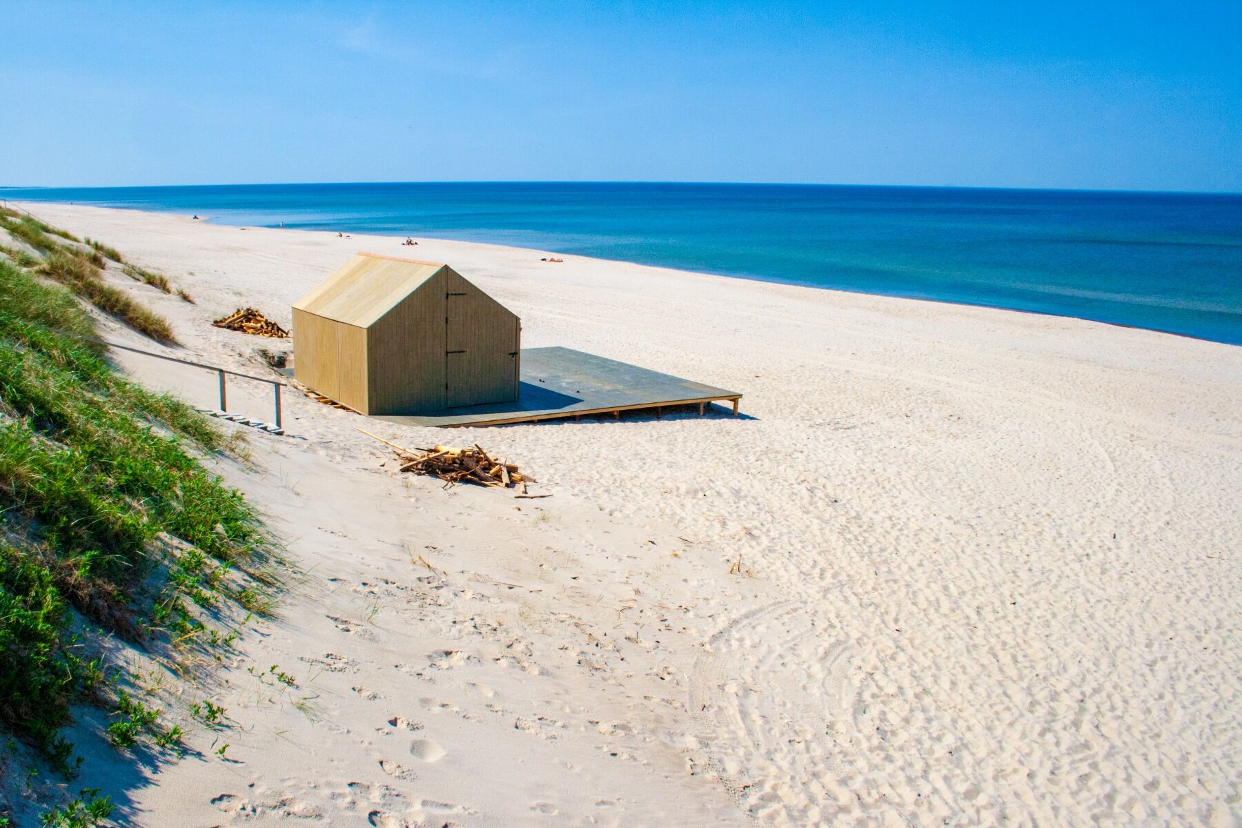 Beach hut set in sand