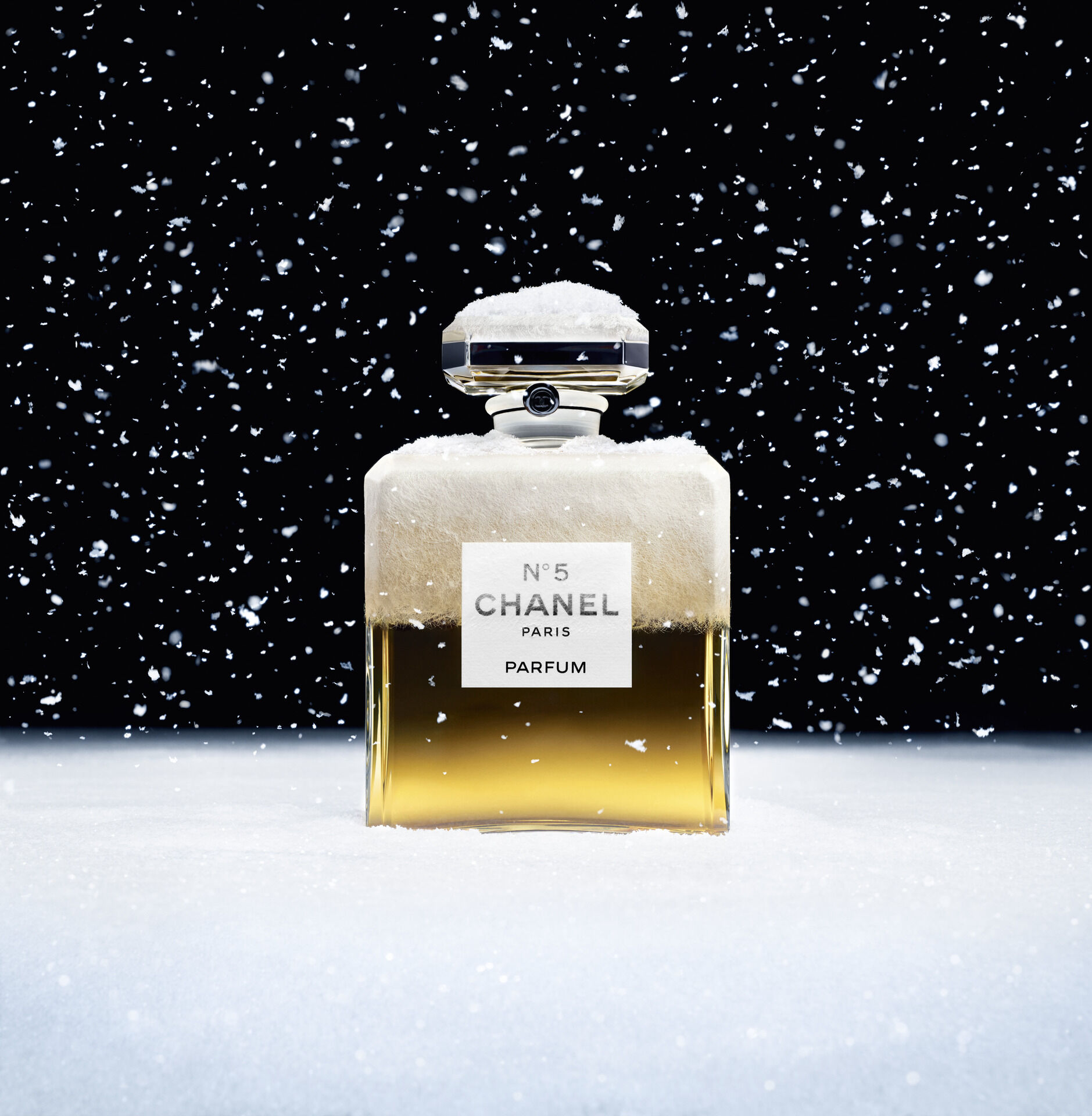 Chanel 5 ad bottle in snow