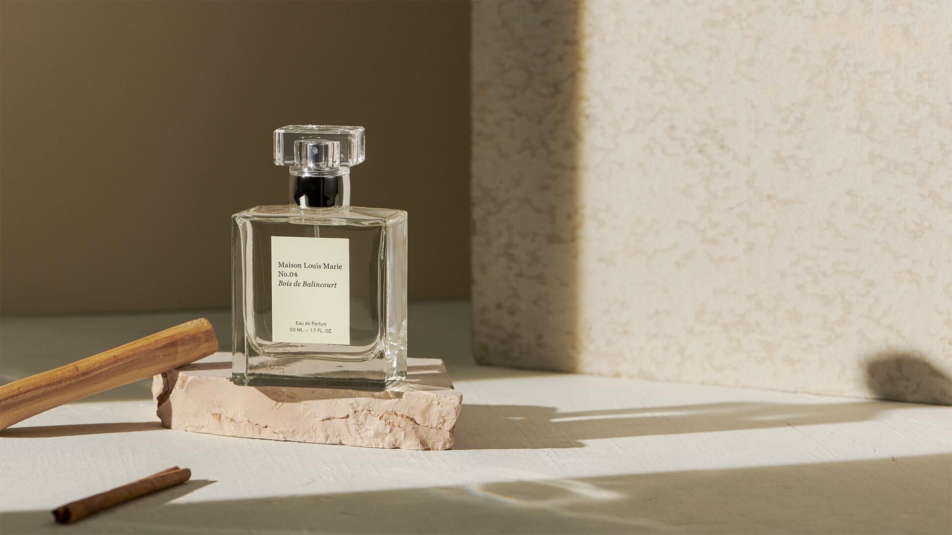 A Maison Louis Marie fragrance on a stone surface