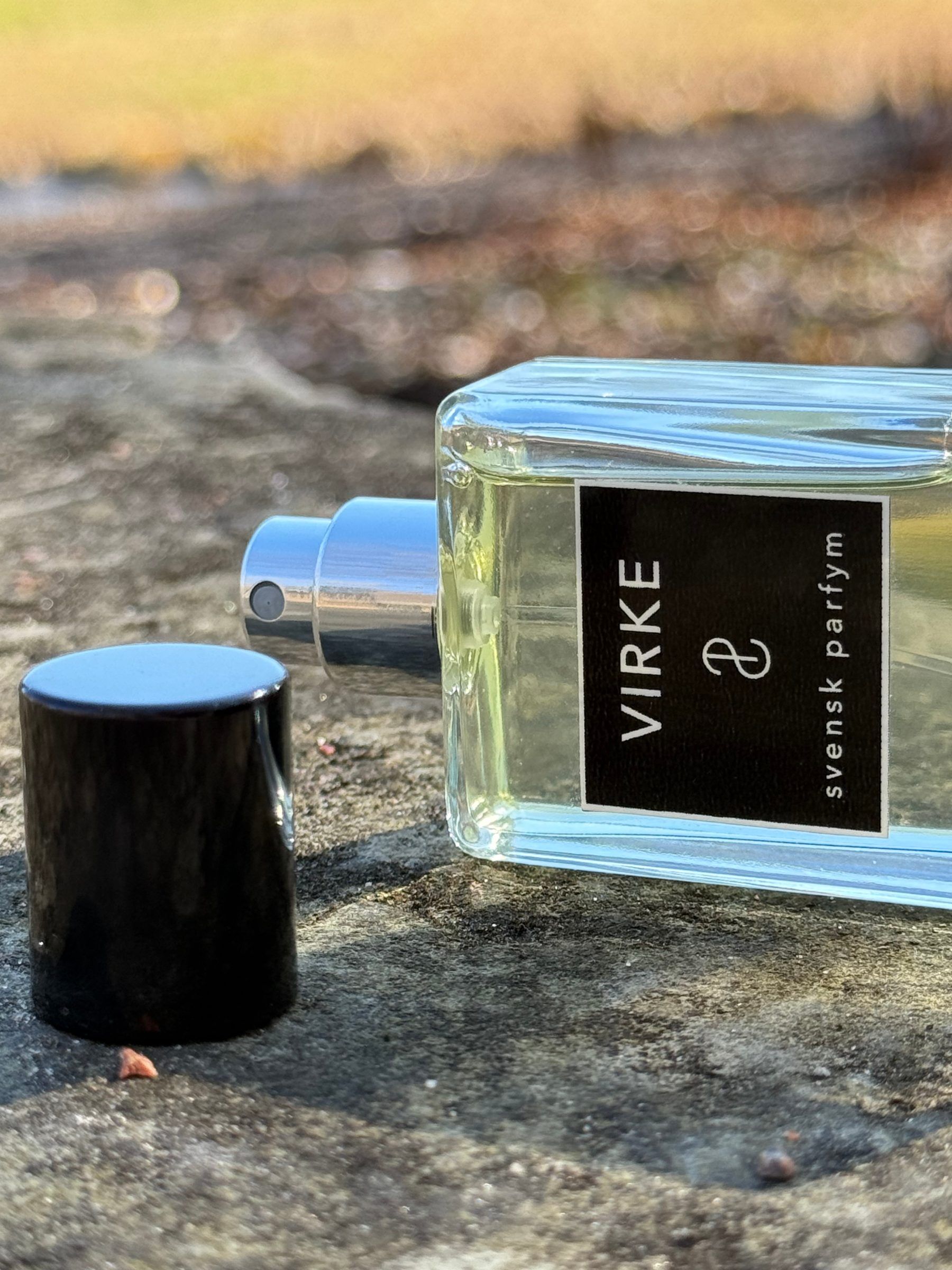 Virke with its cap off laid on a rock