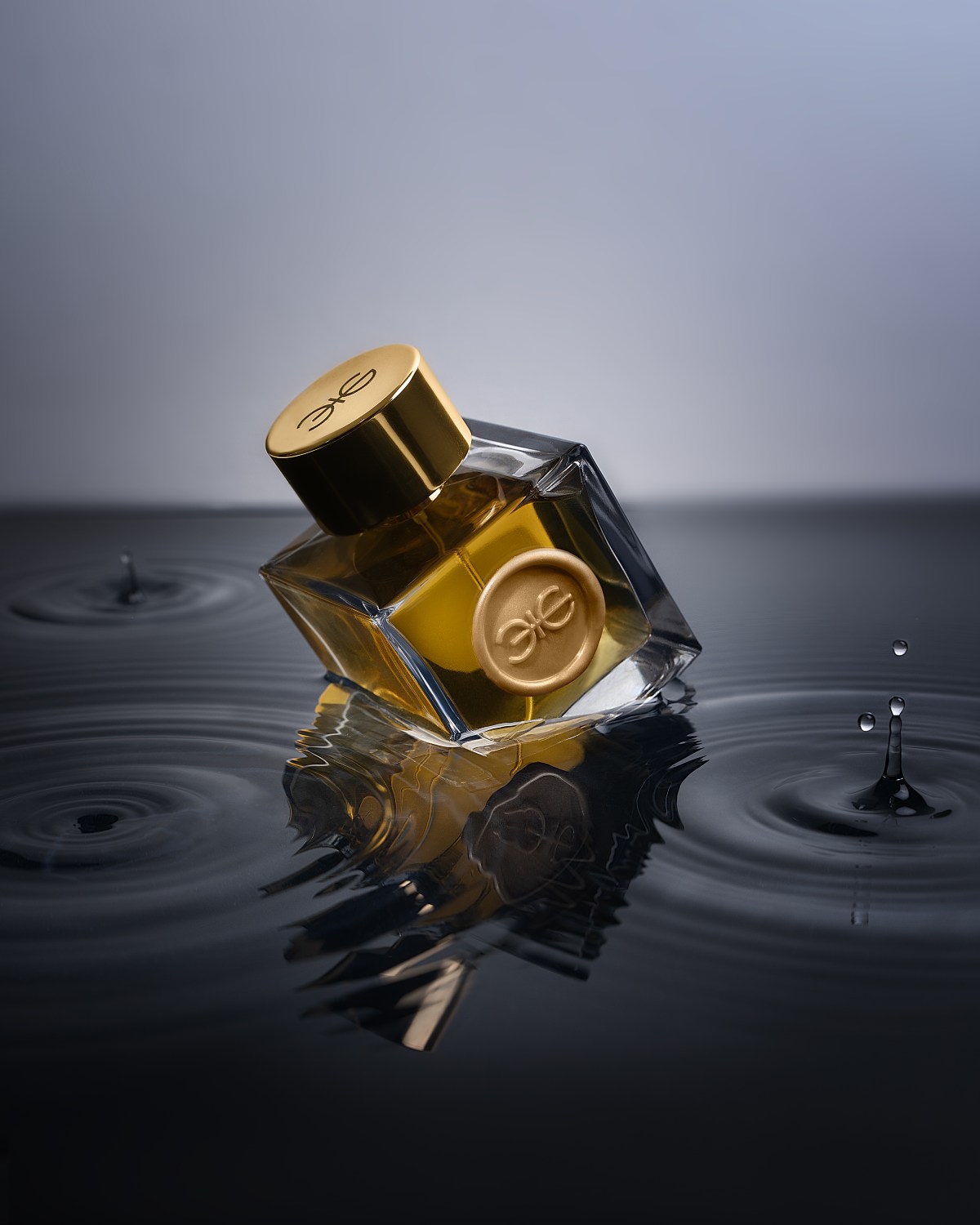 A cube bottle of Citrine standing on water
