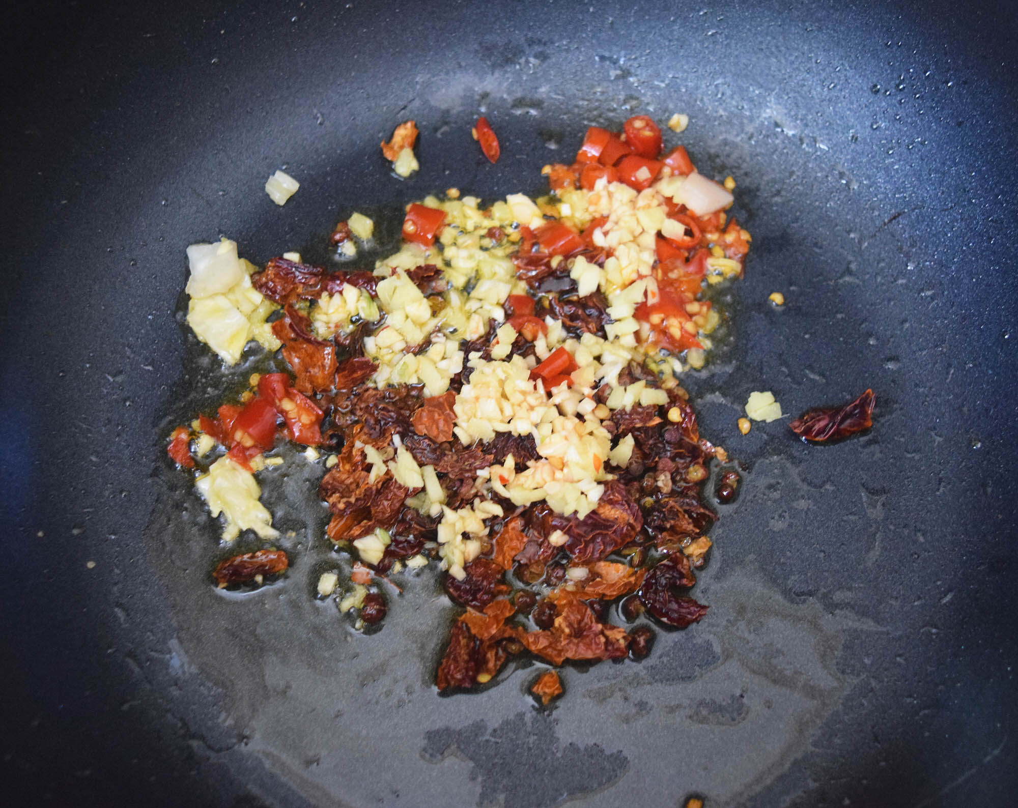 Cooking the chilis and garlic.
