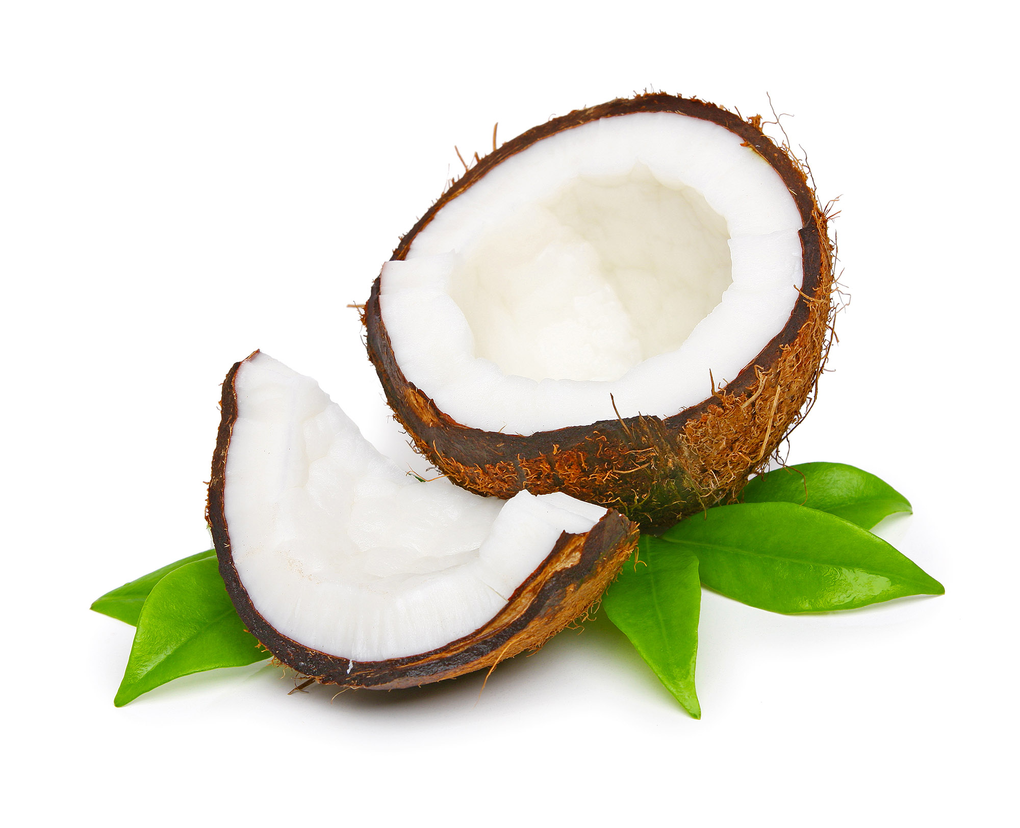 A halved coconut on leaves.