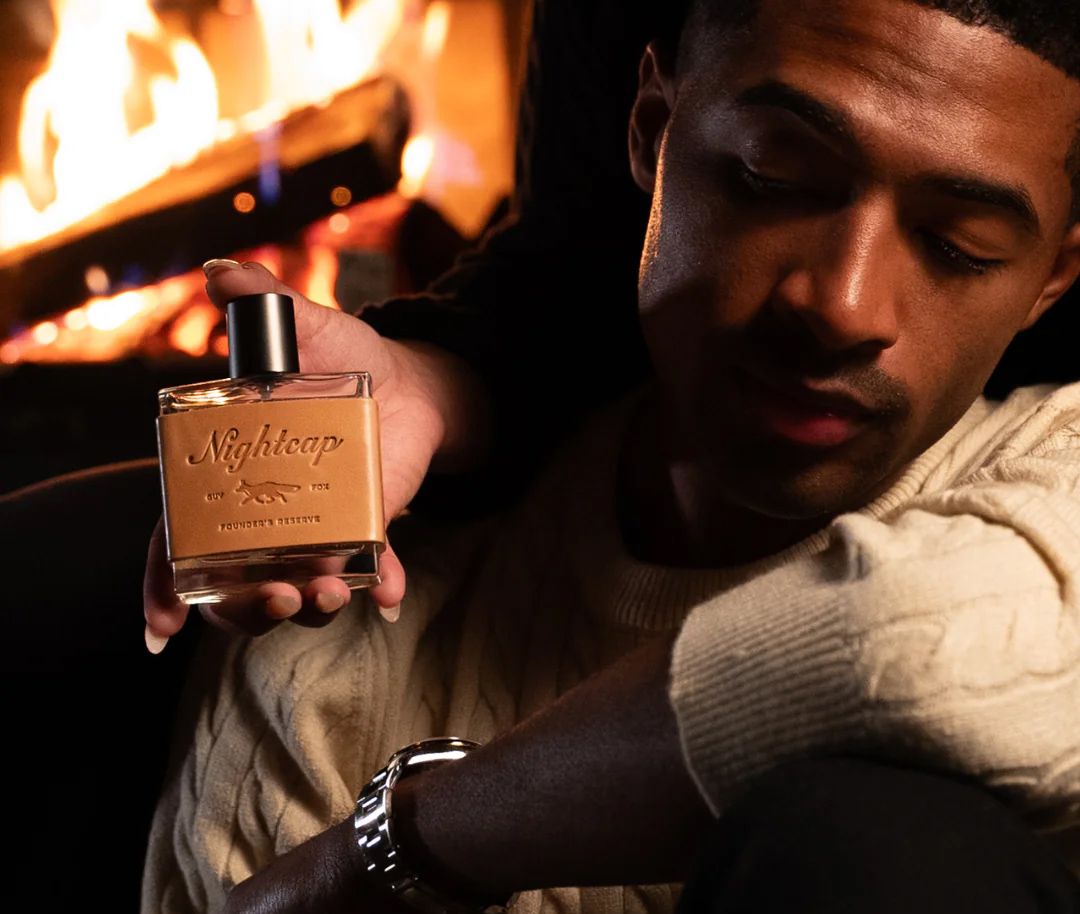 Nightcap Perfume with model on far right.