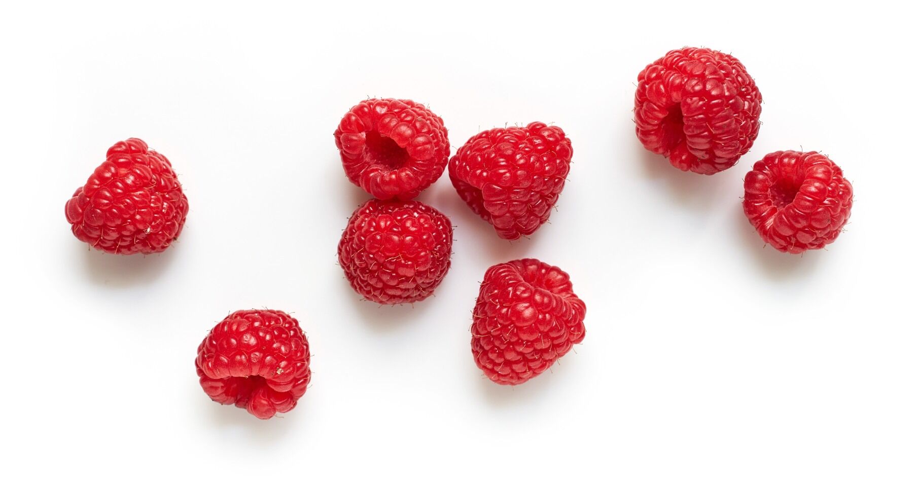 Raspberries on a white background
