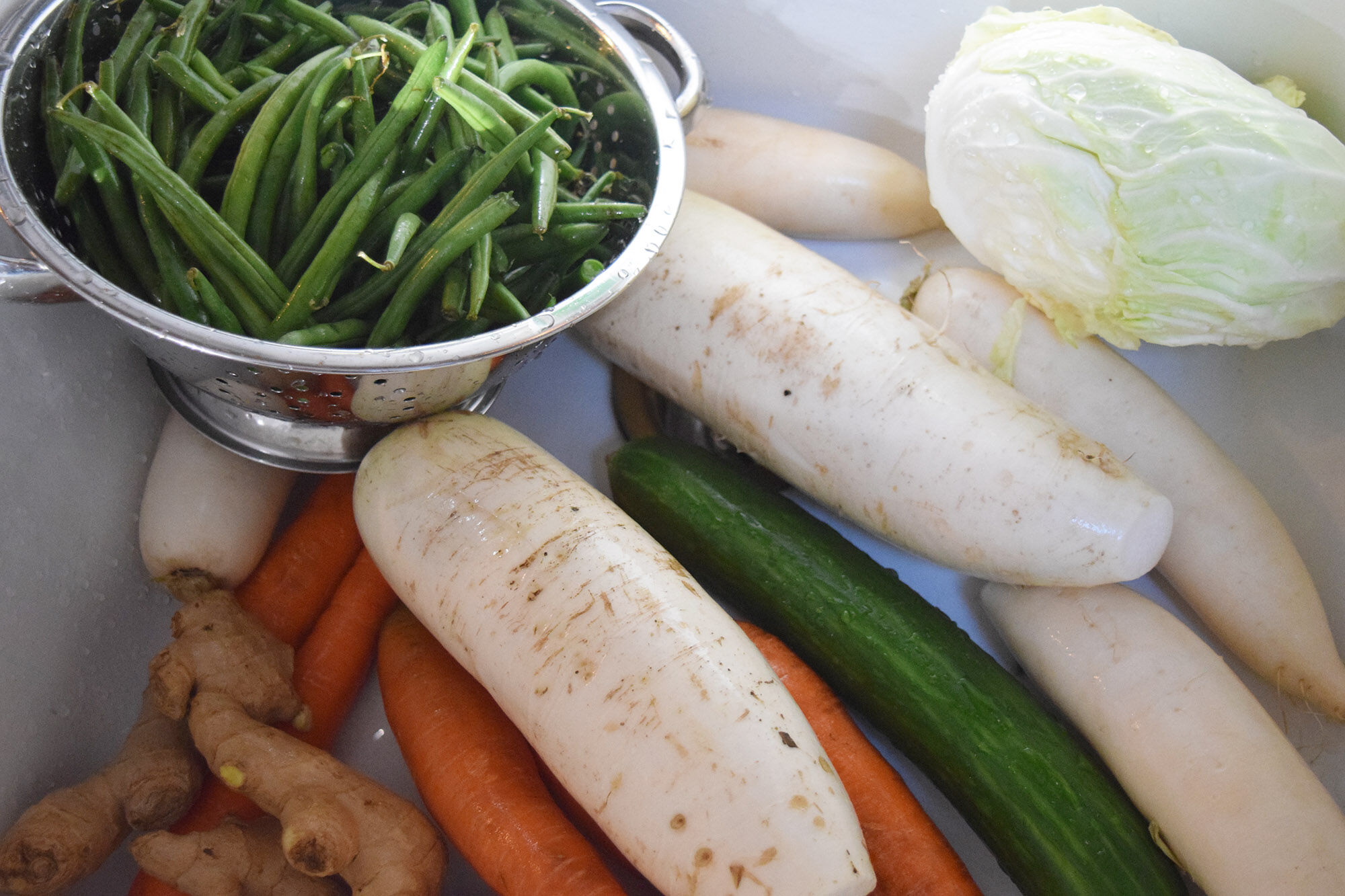 Washed vegetables in a sink.