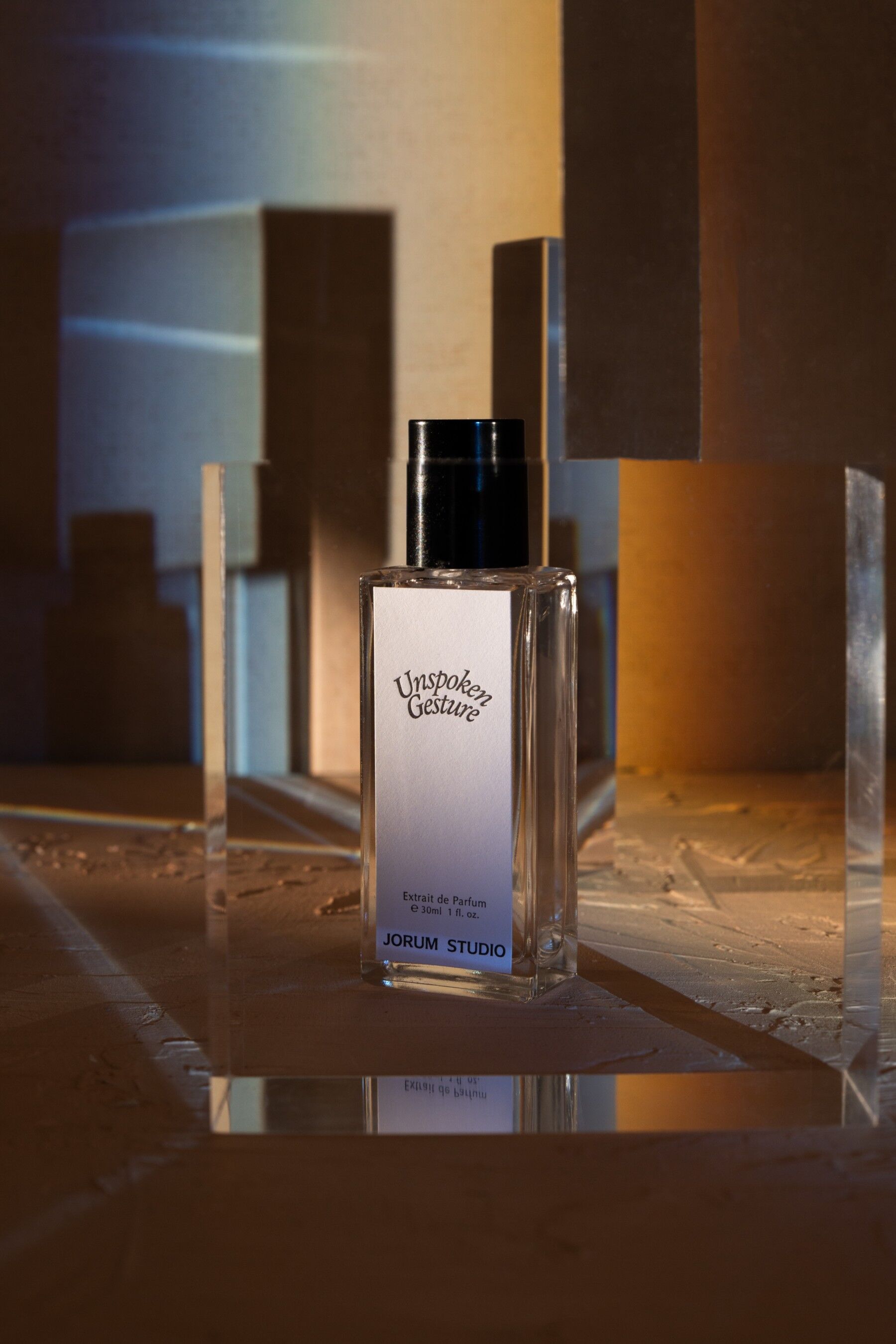 Unspoken Gesture perfume in a moodily lit setting