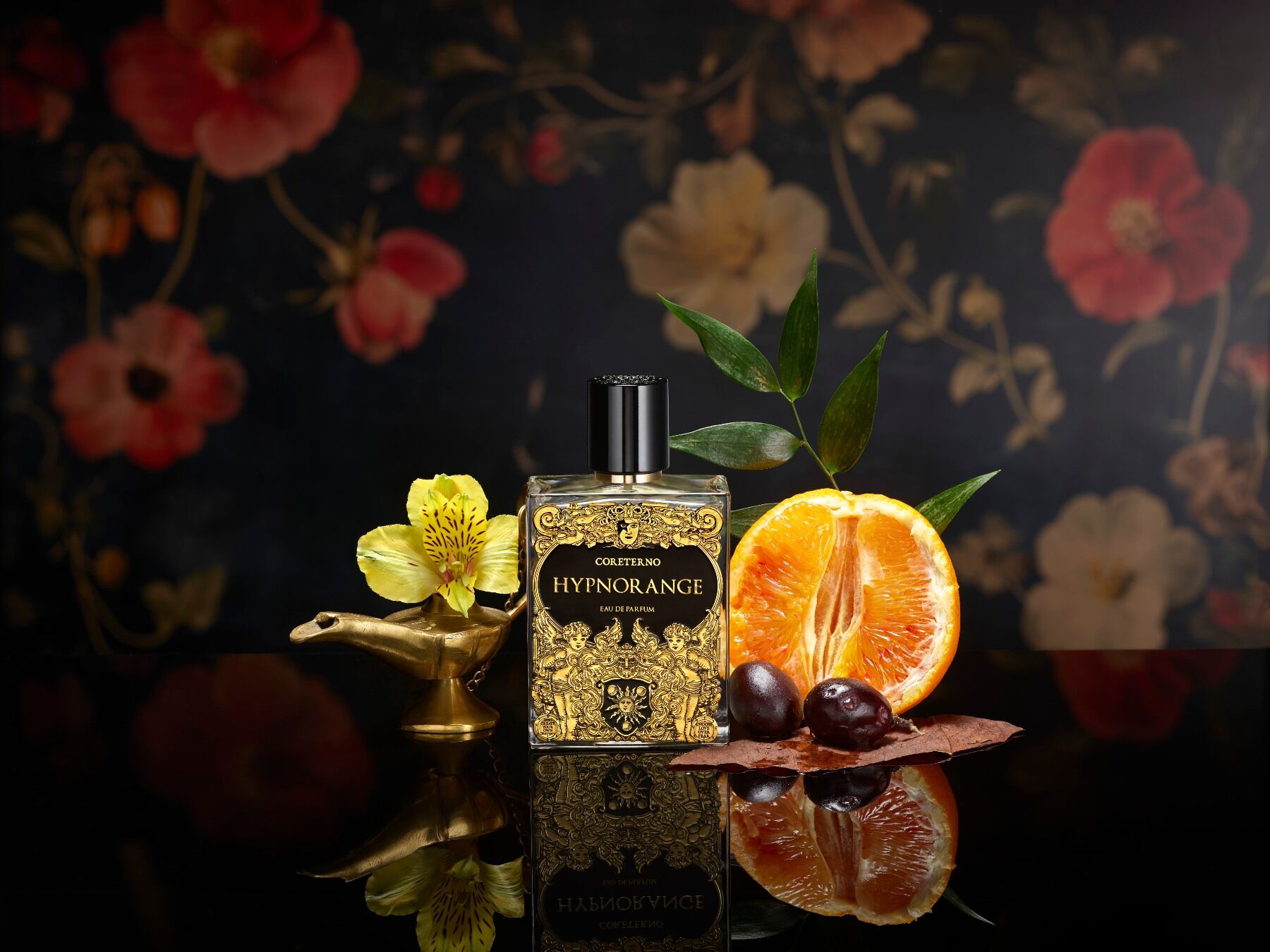Hypnorange by Coreterno set in a dark room with busy wall paper, an orange and some sticky substance