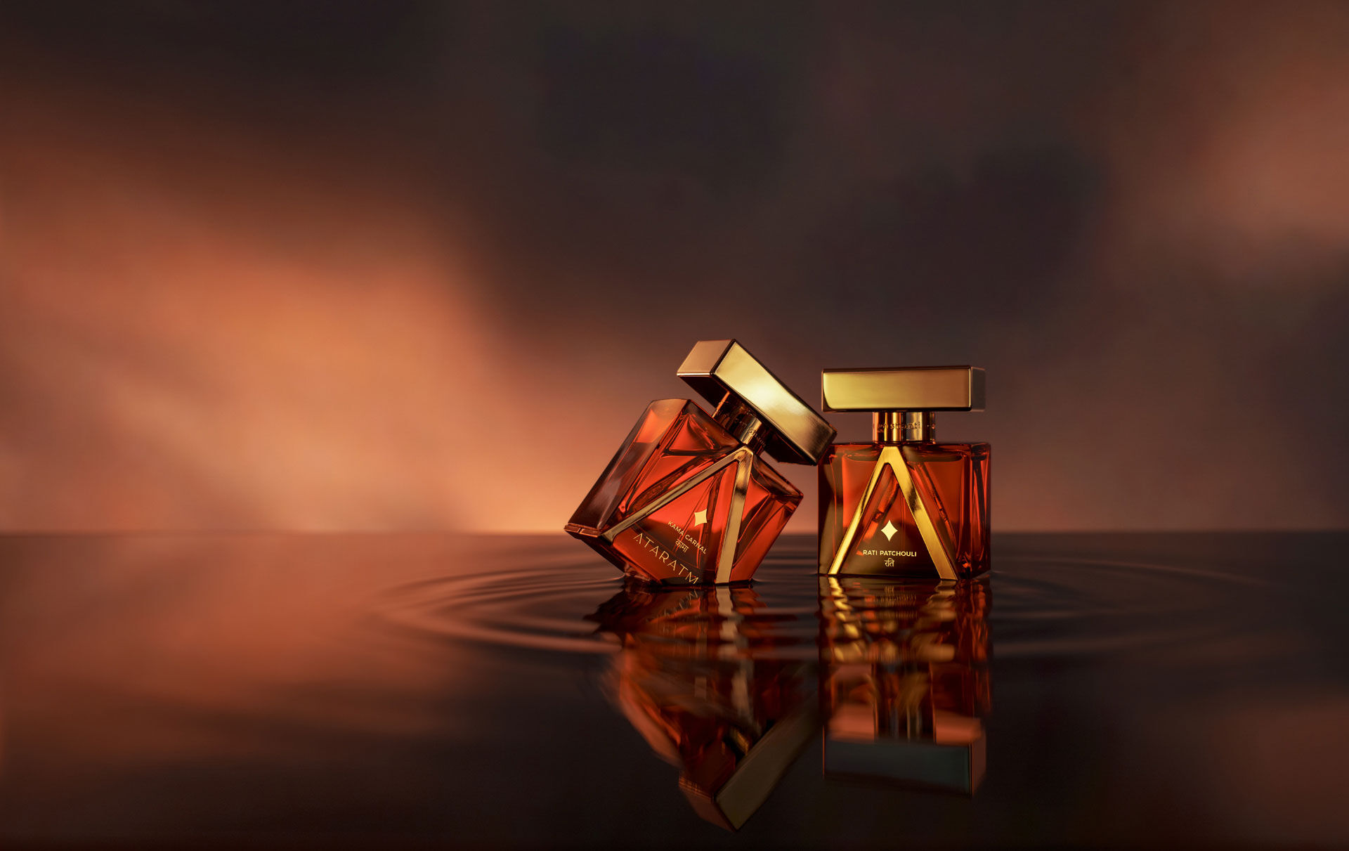 Two bottles from Ataratma standing in what appears to be aubergine coloured water