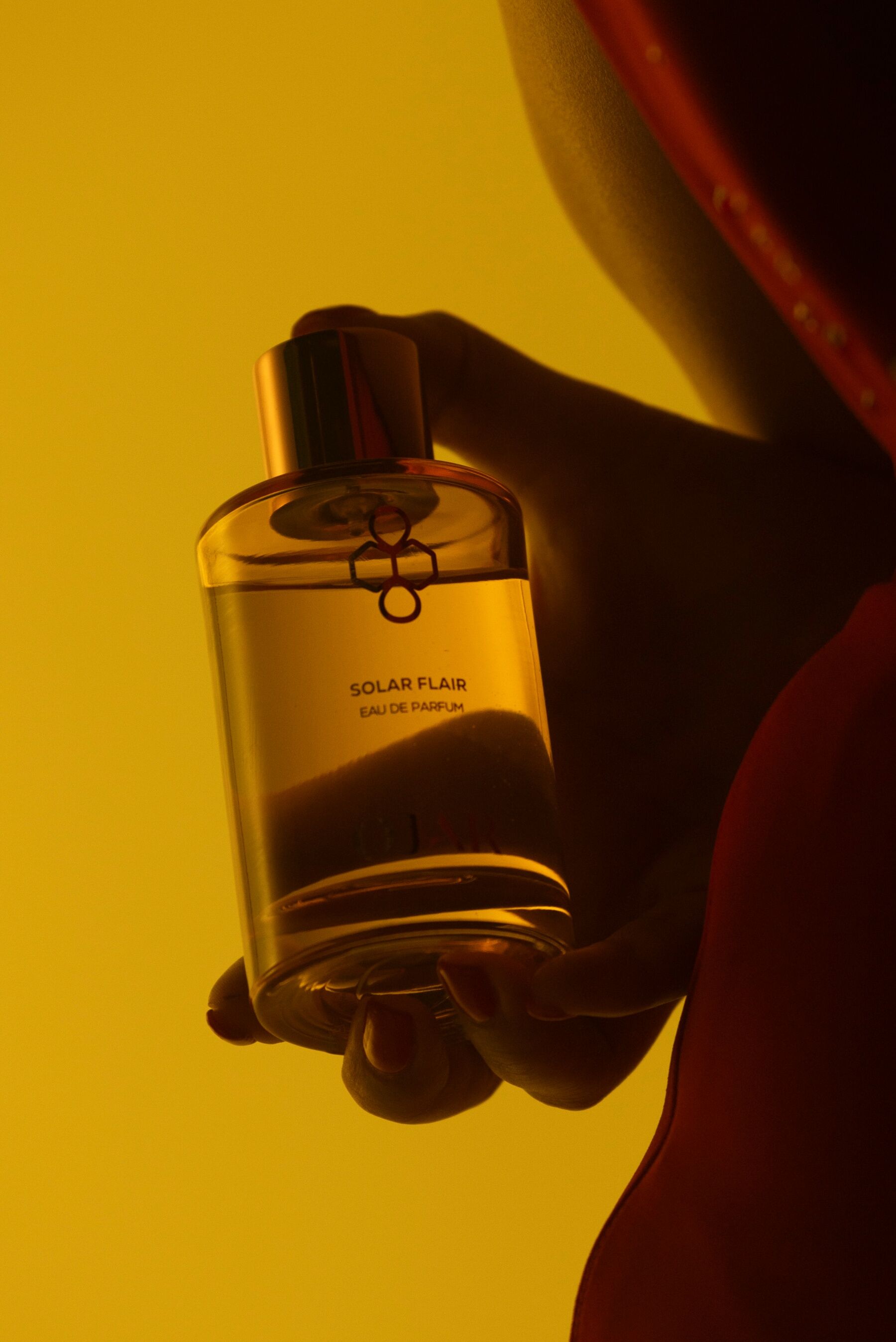 A yellow toned bottle of Solar Flair by Ojar
