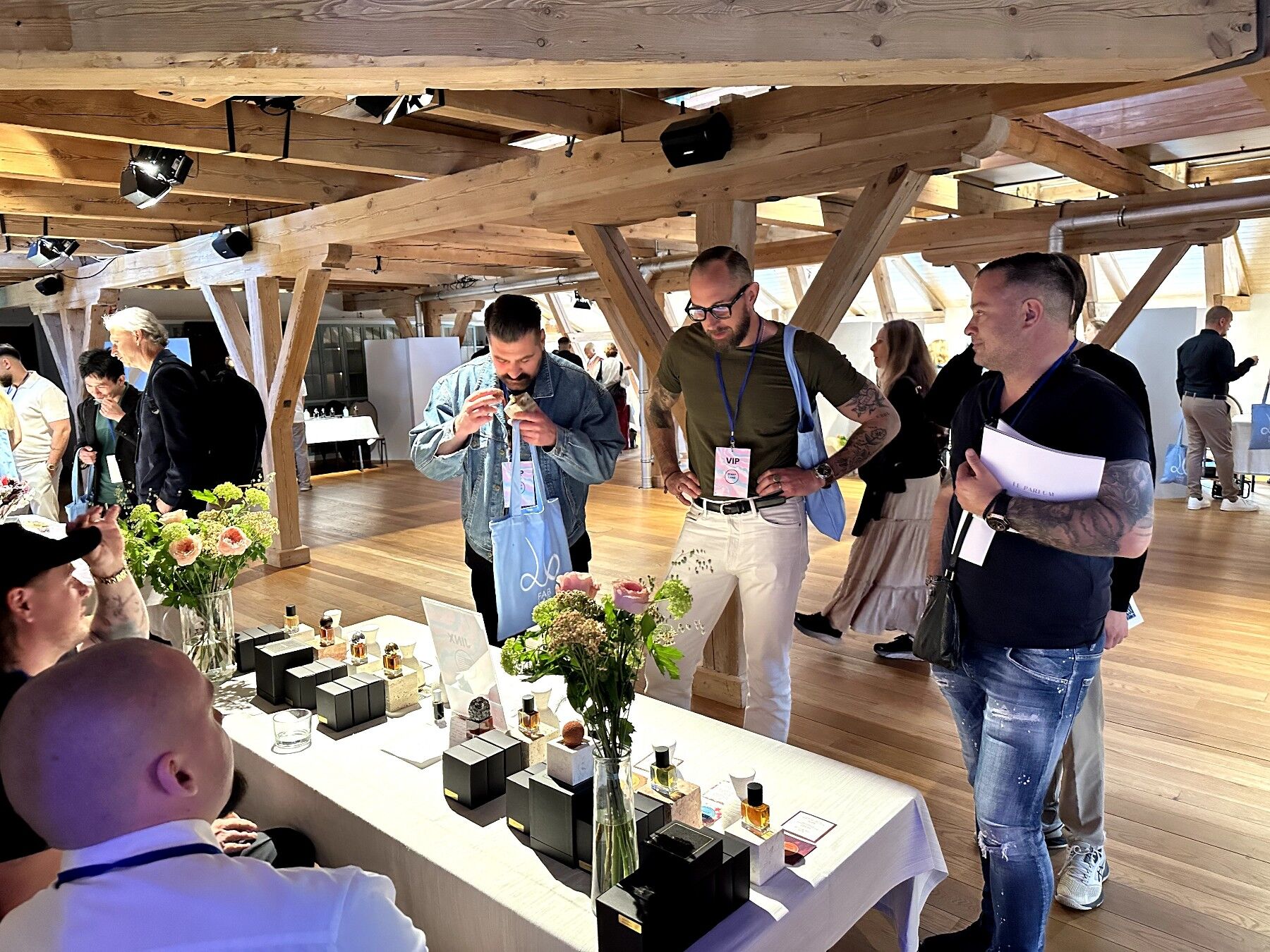 A group of visitors smelling fragrances at the event