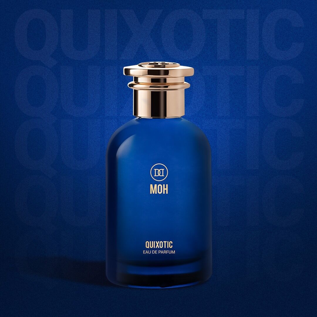 A bottle of Quixotic on a blue backdrop with the name faintly displayed