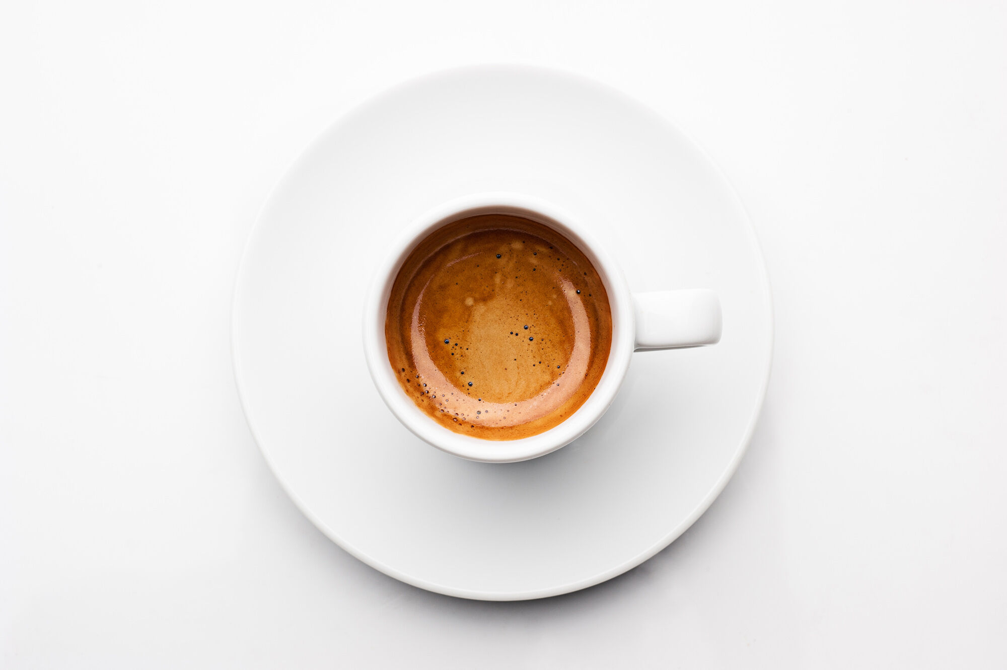 Espresso in a cup on a white background.