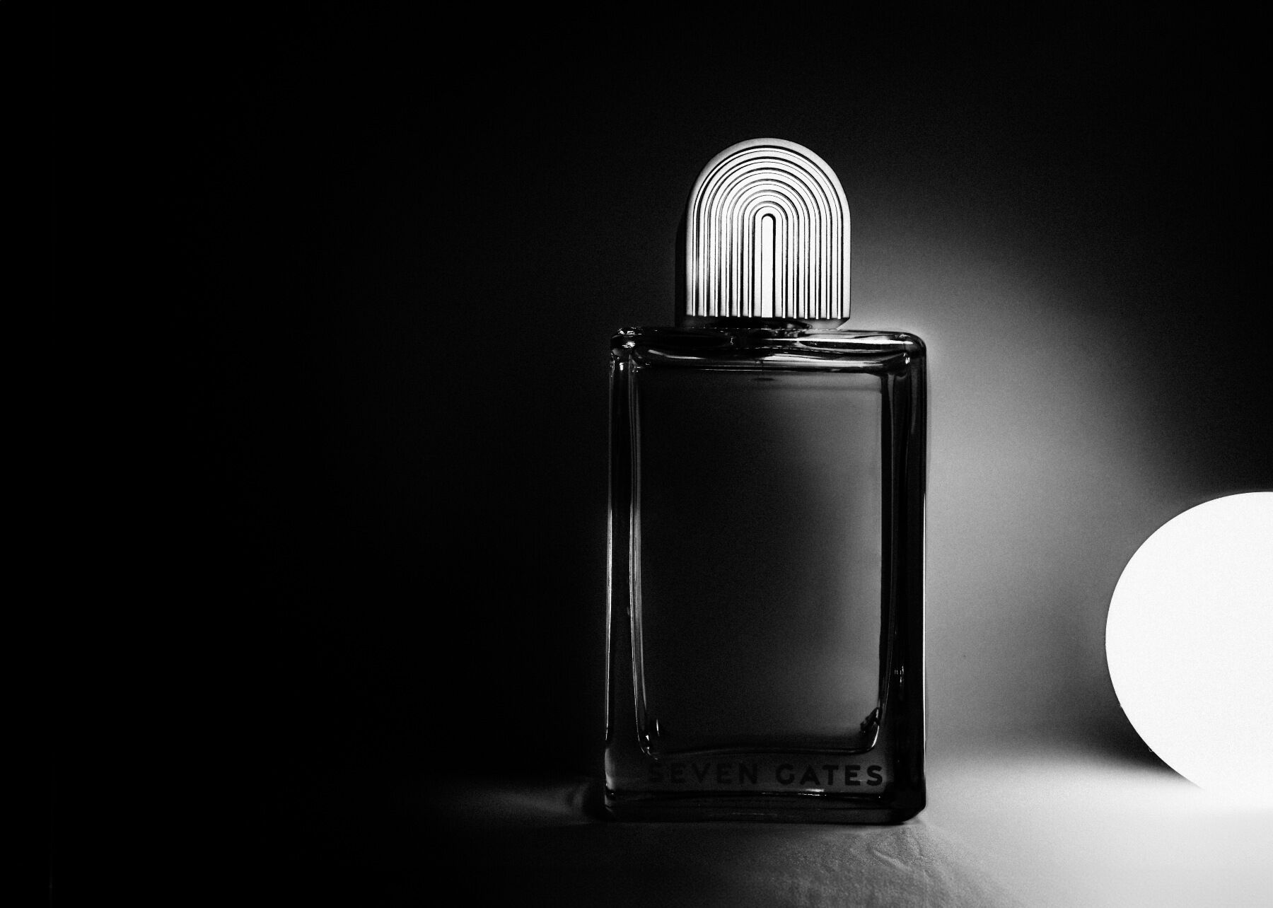 A Seven Gates bottle in black and white looking moody and atmospheric