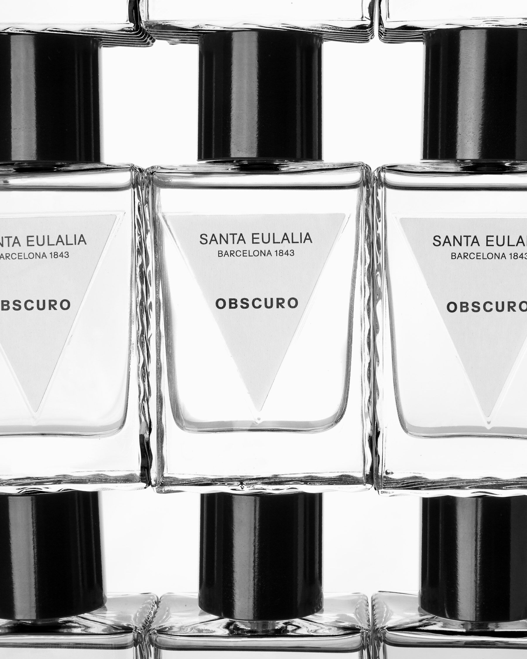 Obscuro perfumes stacked in a tile pattern