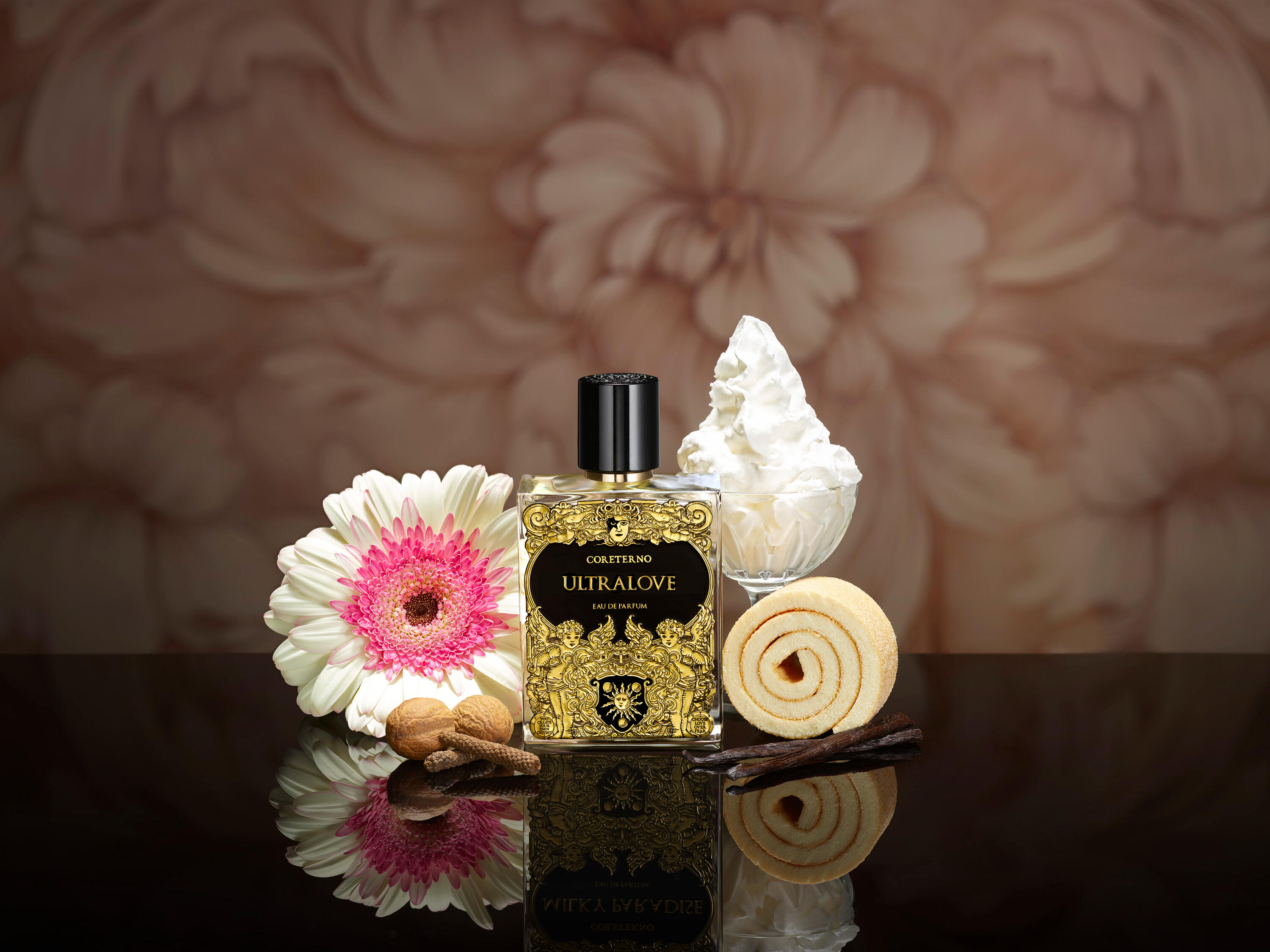 Coreterno's Ultralove with cake and flowers on a reflective surface