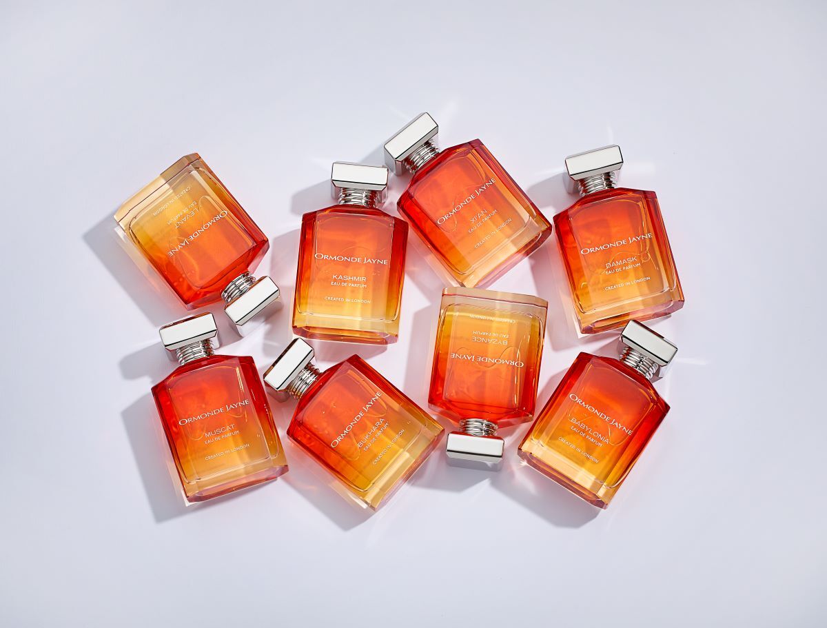 A group of Ormonde Jayne fragrances in ombre orange bottles