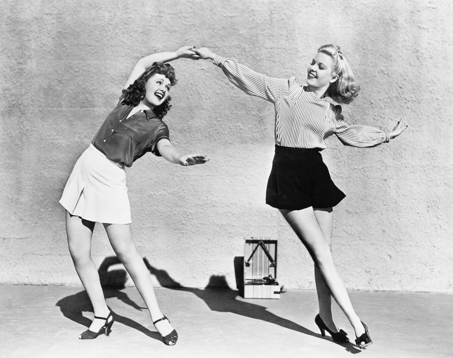 Two vintage styled ladies dancing
